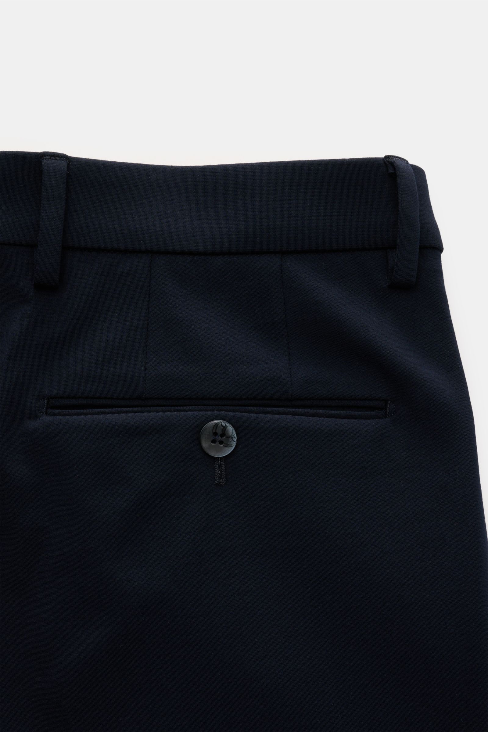 Close-up back view of navy GTA Trousers 'Federico' showing waistband, belt loops, and jetted back pocket with button, made of soft, slightly elastic viscose and microfibre blend for stylish office looks.

Description: For stylish office looks: The trou