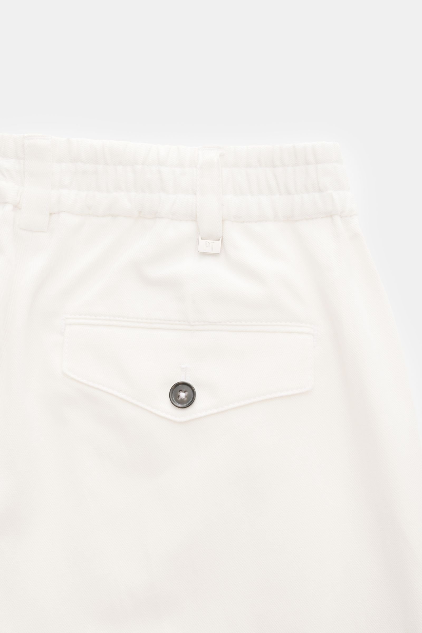 Close-up rear view of PT Torino Jogger pants 'The Rebel' off-white showing elasticated waistband, button flap back pocket, cotton-linen blend.