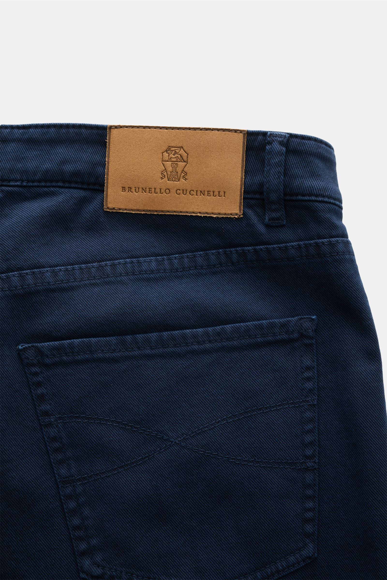 Close-up rear view of Brunello Cucinelli Jeans 'Traditional Fit' navy showing a leather patch with logo above the back pocket. A luxurious denim classic from BRUNELLO CUCINELLI: The versatile jeans 'Traditional Fit' in a relaxed fit with an authentic wash