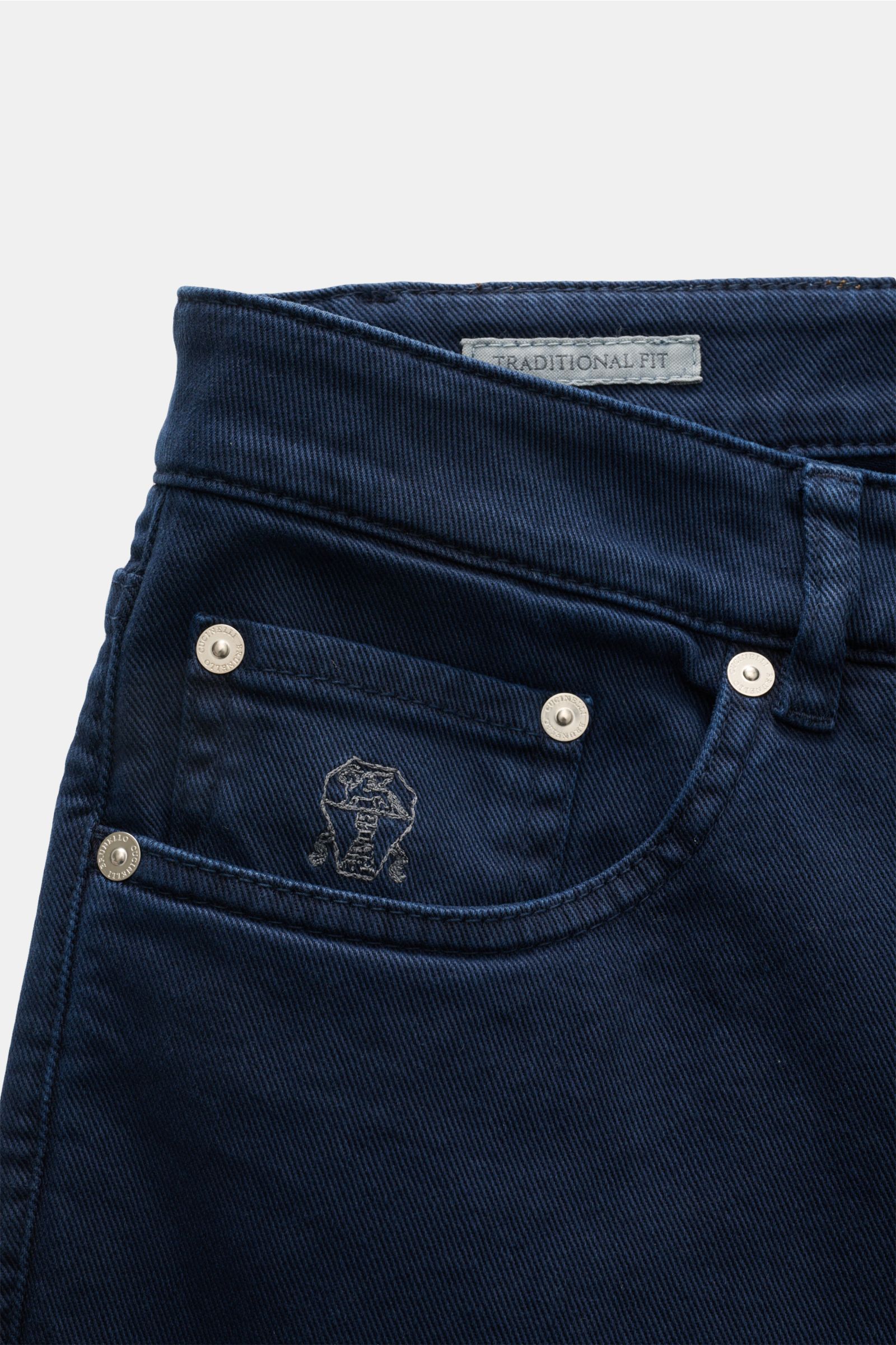 Close-up front view of Brunello Cucinelli Jeans 'Traditional Fit' navy, showcasing button fly, five-pocket style, logo-stitched coin pocket, and leather patch. A luxurious denim classic from BRUNELLO CUCINELLI: The versatile jeans 'Traditional Fit' in a r