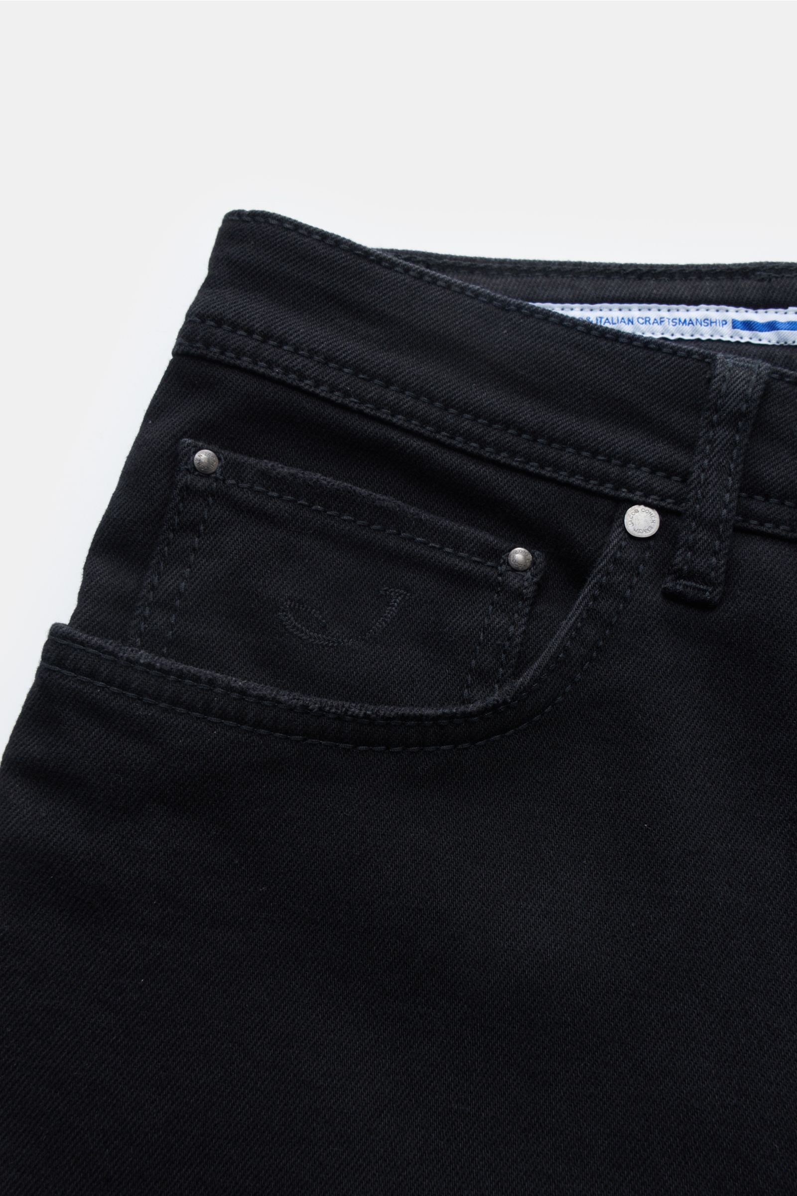 Close-up front view of Jacob Cohen Jeans 'Bard' black (formerly J688) showing denim cotton-microfibre fabric, slight stretch, lightweight robust fabric, slim fit, slightly tapered cut, button fly, five-pocket style, coin pocket with initial, and signature