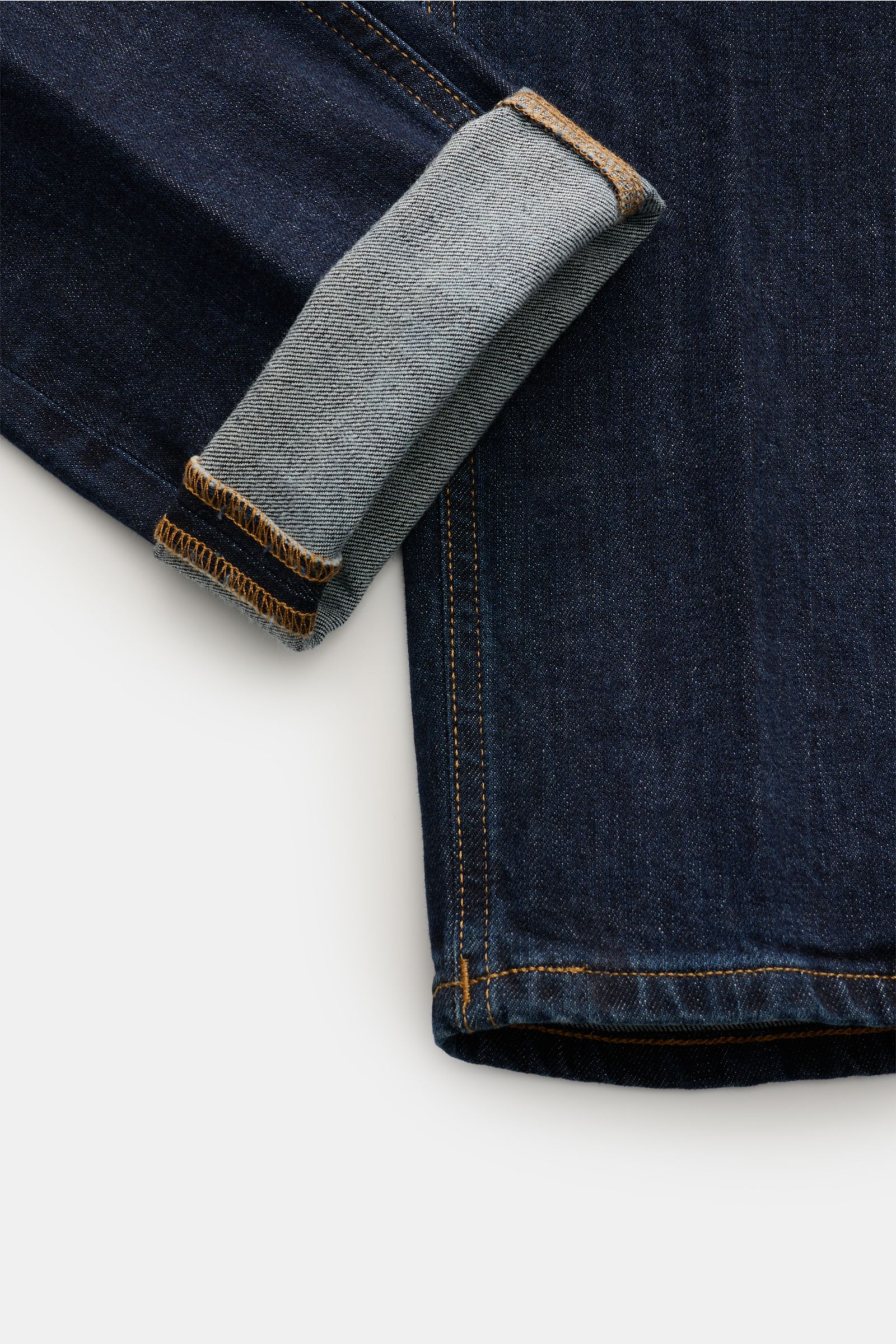 Dondup Jeans 'George' navy, Detailansicht vom Bein mit umgeschlagenem Saum, Denim aus Baumwolle, elastisch, Skinny Fit, niedrige Bundhöhe, Five-Pocket-Stil, Button Fly, Münztasche, Gesäßtaschen mit Stitching, Metall-Initial und innenliegendem Weblabel.