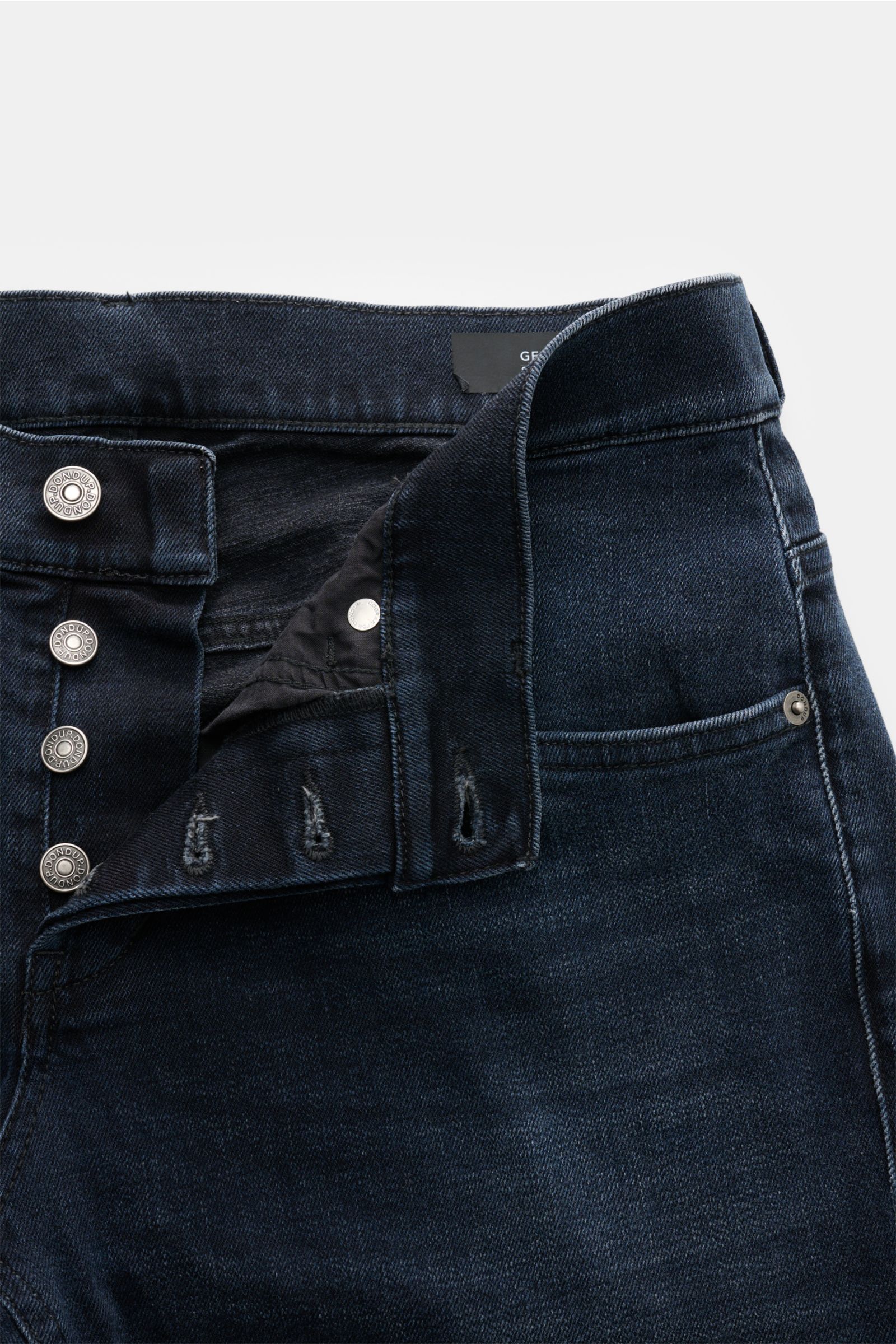 Close-up top-front view of Dondup Jeans 'George' grey-blue with unbuttoned button fly, showing elasticated cotton fabric and pocket details.

Description: Casual all-rounder: The jeans 'George Skinny Fit' by DONDUP, made of slightly stretchy cotton mat