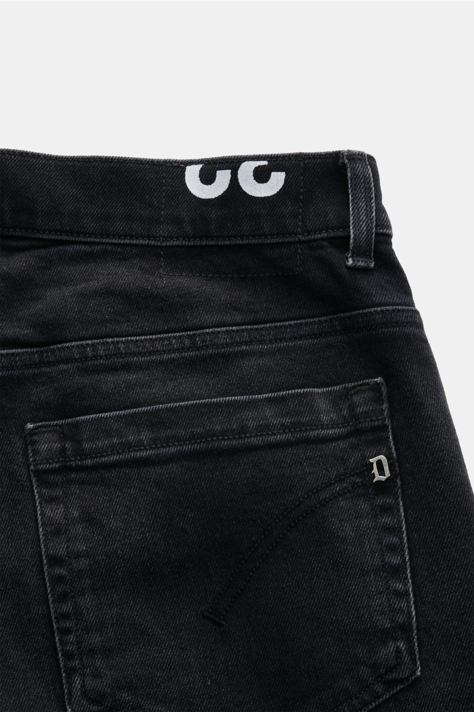 Close-up rear view of Dondup Jeans 'George' anthrazit in dark cotton denim with slightly elastic, grippy texture, featuring skinny fit, low rise, button fly, five-pocket style, piped coin pocket, stitched back pockets, metal initial, and inner woven label