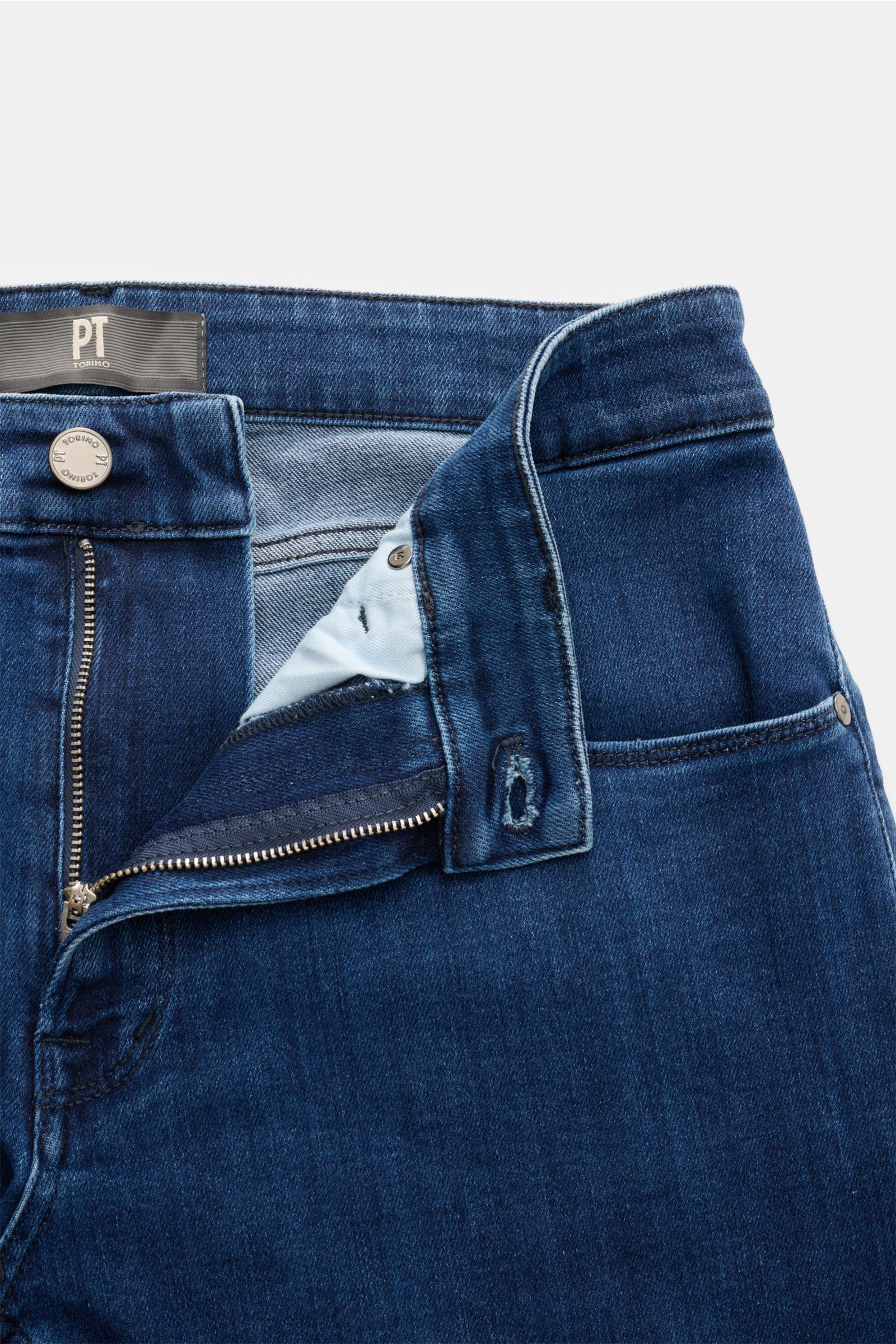 Close-up front view of PT Torino Denim Jeans 'Jazz' dunkelblau with zip fly open, showcasing dark blue cotton-lyocell denim, slim fit, five-pocket style, soft texture, and subtle used wash for timeless style and comfort.