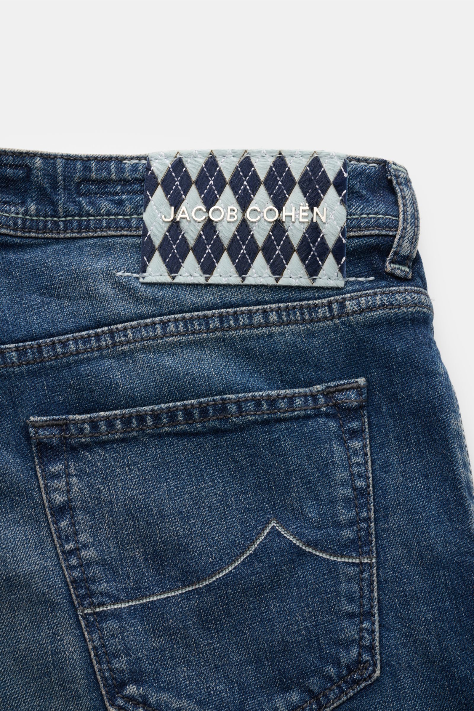 Jacob Cohen Jeans 'Bard' navy shown from the back, highlighting the denim cotton, lyocell, microfiber fabric, slim fit, soft feel, contrast stitching, button fly, five-pocket style, coin pocket with initial, back pockets with stitching, and leather patch 