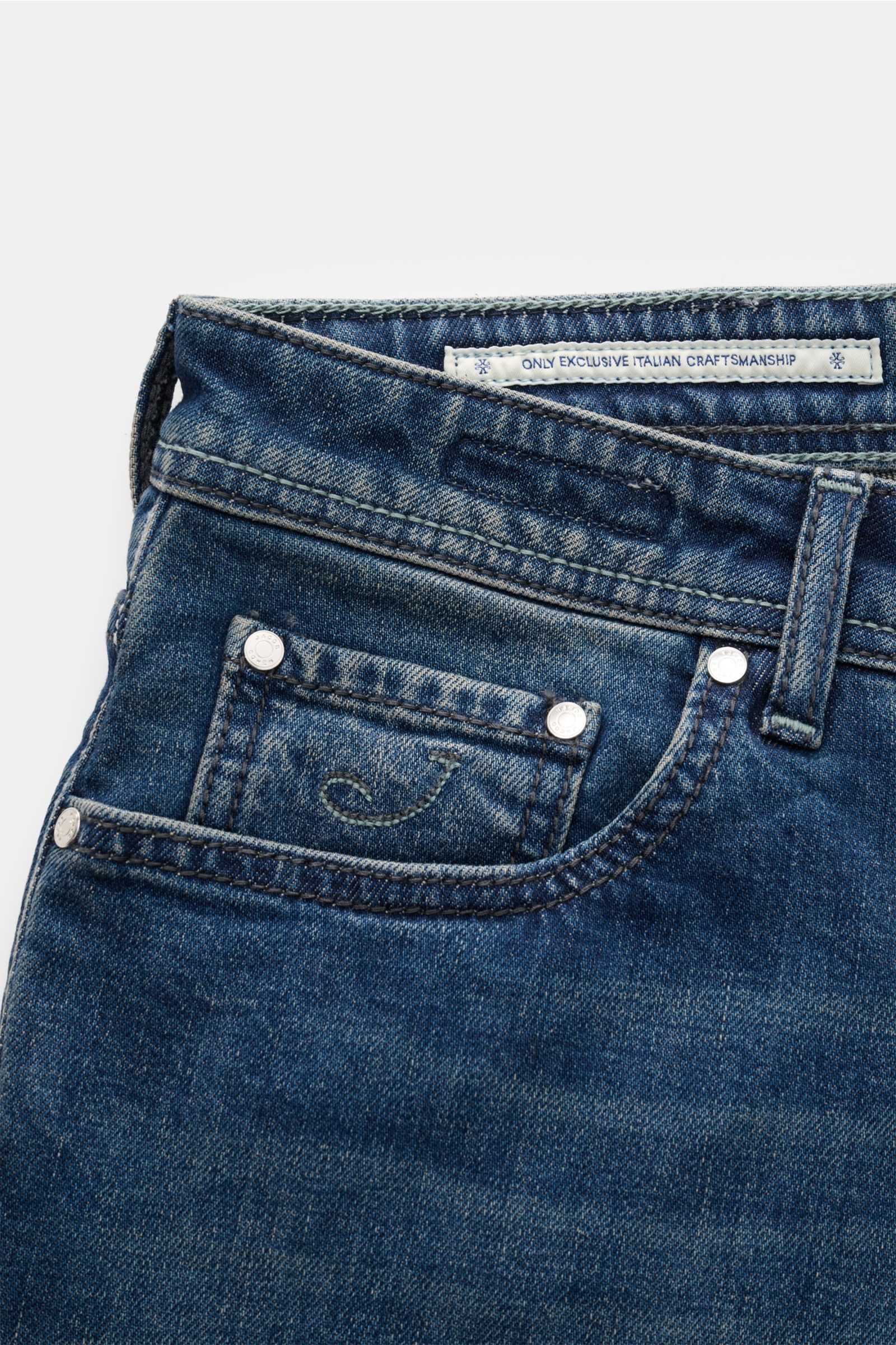 Close-up front view of Jacob Cohen Jeans 'Bard' navy in denim of cotton, lyocell, microfiber, slim fit, soft touch, lightly elastic, contrasting seams, button fly, five-pocket style, coin pocket with initial, back pockets with stitching, leather patch.