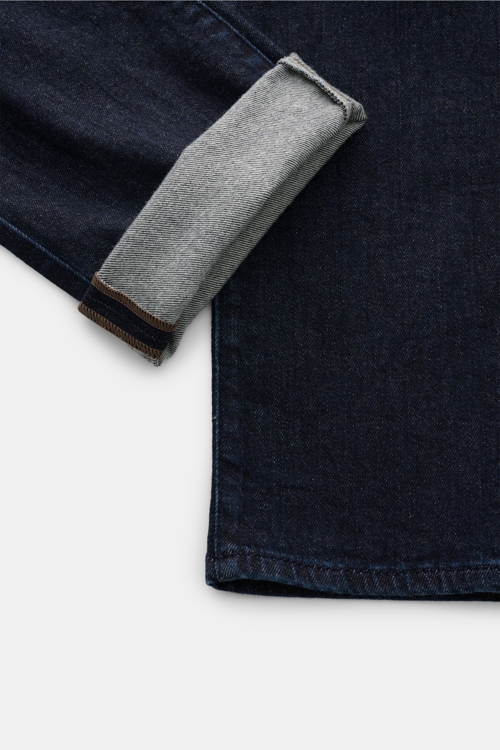 Close-up front-side view of Jacob Cohen Jeans 'Bard' navy, showing dark denim cotton and cashmere fabric, lightly elastic, soft touch, slim fit, tapered leg, button fly, five-pocket style, coin pocket with initial, tonal stitching on back pockets, and lea