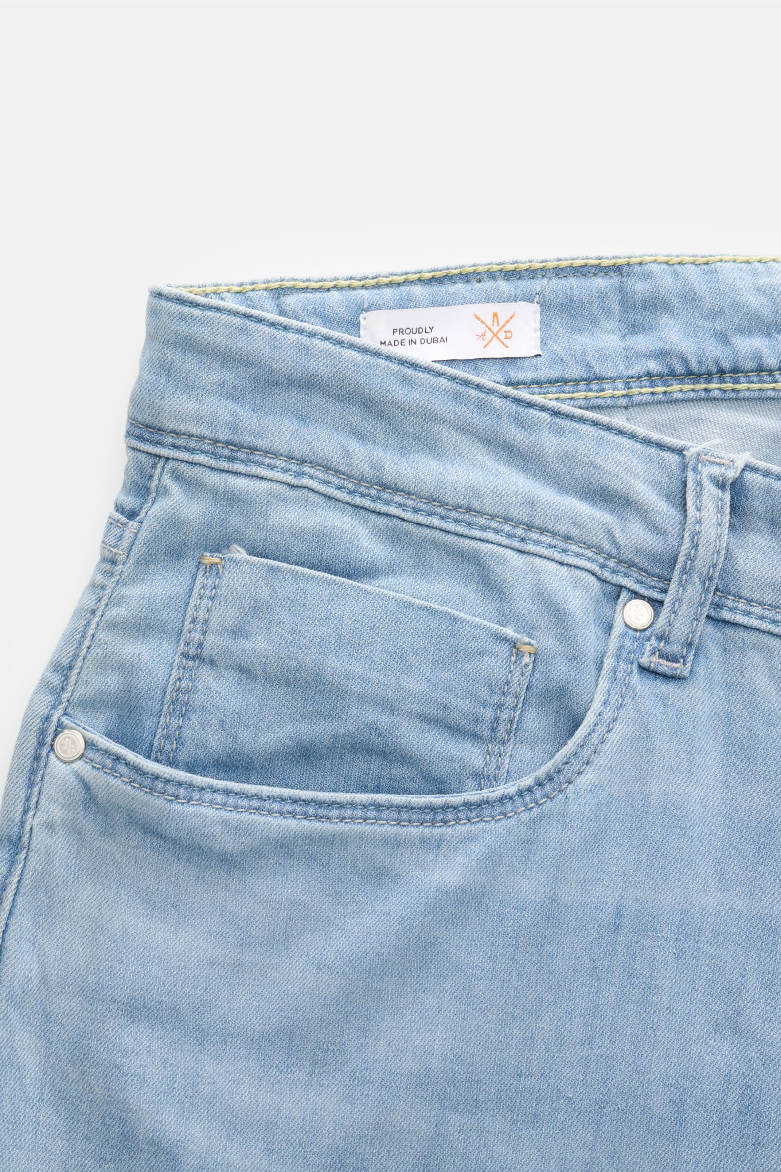 Ace Denim Jeans 'AD 15 bleached' light blue shown from a close-up front top perspective, highlighting the slight stretch cotton, lyocell and linen blend material, soft feel, authentic used wash, slim fit, very tapered cut, button fly, five-pocket style in