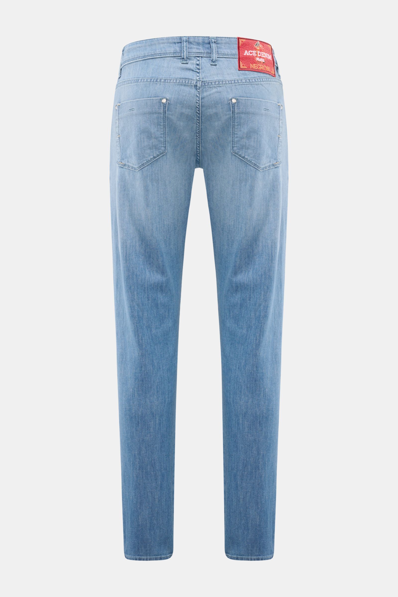 Rear view of Ace Denim Jeans 'AD 15 bleached' smoky blue, slim fit with very tapered cut, authentic used wash, button fly, five-pocket style, soft cotton, lyocell, and linen blend with slight stretch, featuring a woven patch and coin pocket.