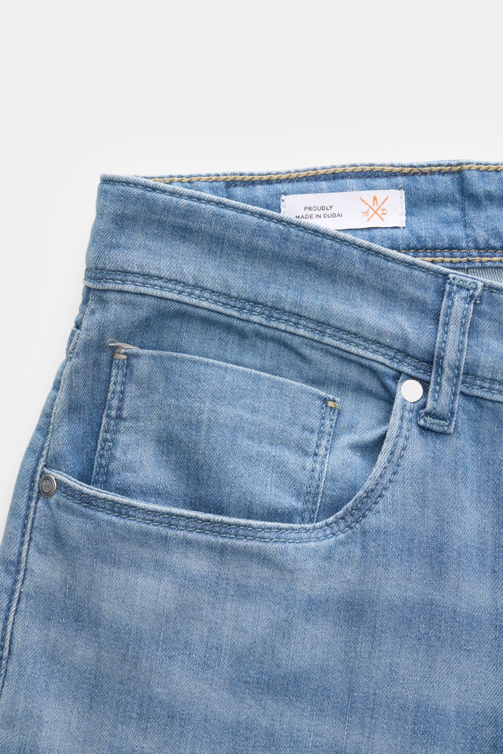 Close-up front view of Ace Denim Jeans 'AD 15 bleached' smoky blue showing the cotton, lyocell, and linen denim with soft feel, slight stretch, slim fit, button fly, five-pocket style including coin pocket, authentic used wash, very tapered cut, and woven