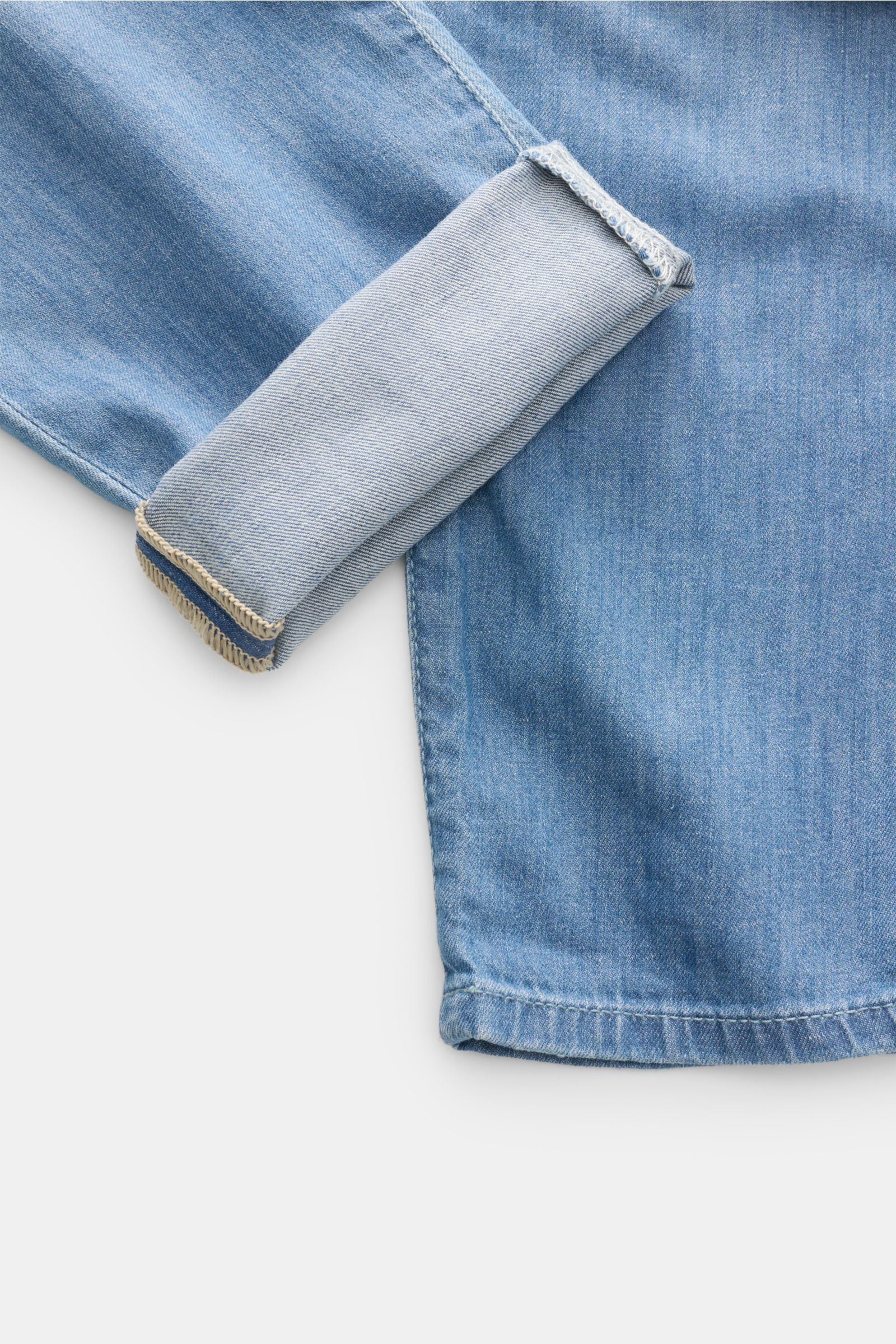 Close-up shot of Ace Denim Jeans 'AD 15 bleached' smoky blue showing cuff turned up, highlighting soft, slim fit denim with slight stretch. 

Description: ACE DENIM stands for hand-made jeans and sustainable production processes – the model 'AD 15' is 