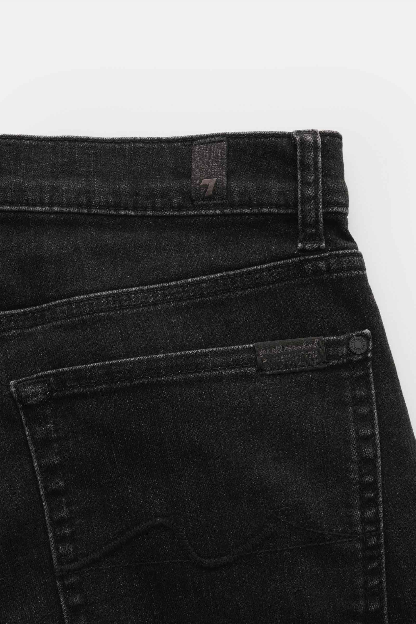 Close-up rear view of 7 for all mankind Jeans 'Slimmy' dark grey, showing back pocket with stitching, small woven label on waistband, and belt loop. 

Seven pairs of jeans should be enough to get you through life – that’s the philosophy of denim label 