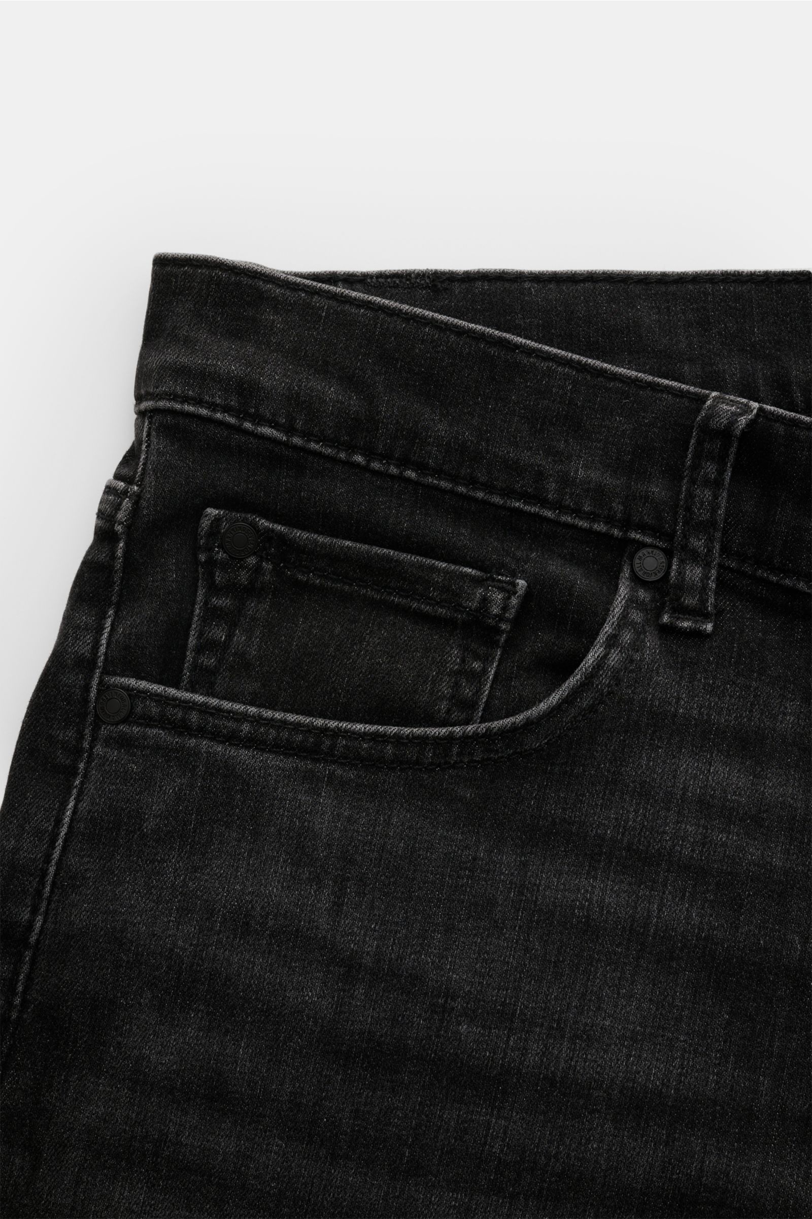 Close-up front-side view of 7 for all mankind Jeans 'Slimmy' dark grey showing subtle used wash, five-pocket style, and small woven waistband label.

Seven pairs of jeans should be enough to get you through life – that’s the philosophy of denim label 7
