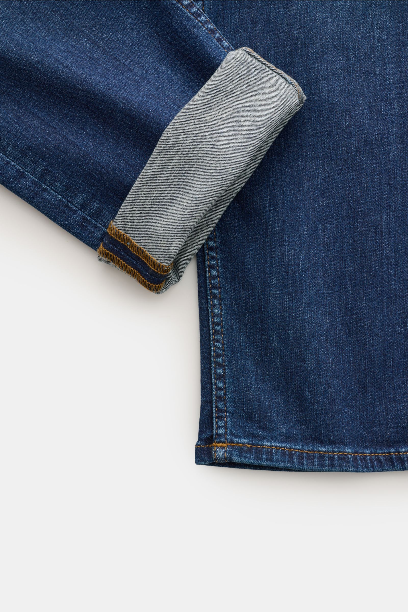 Close-up front view of the cuffed hem of 7 for all mankind Jeans 'Slimmy' dark blue, showcasing slight stretch and authentic used wash.

Description: Seven pairs of jeans should be enough to get you through life – that’s the philosophy of denim label 7