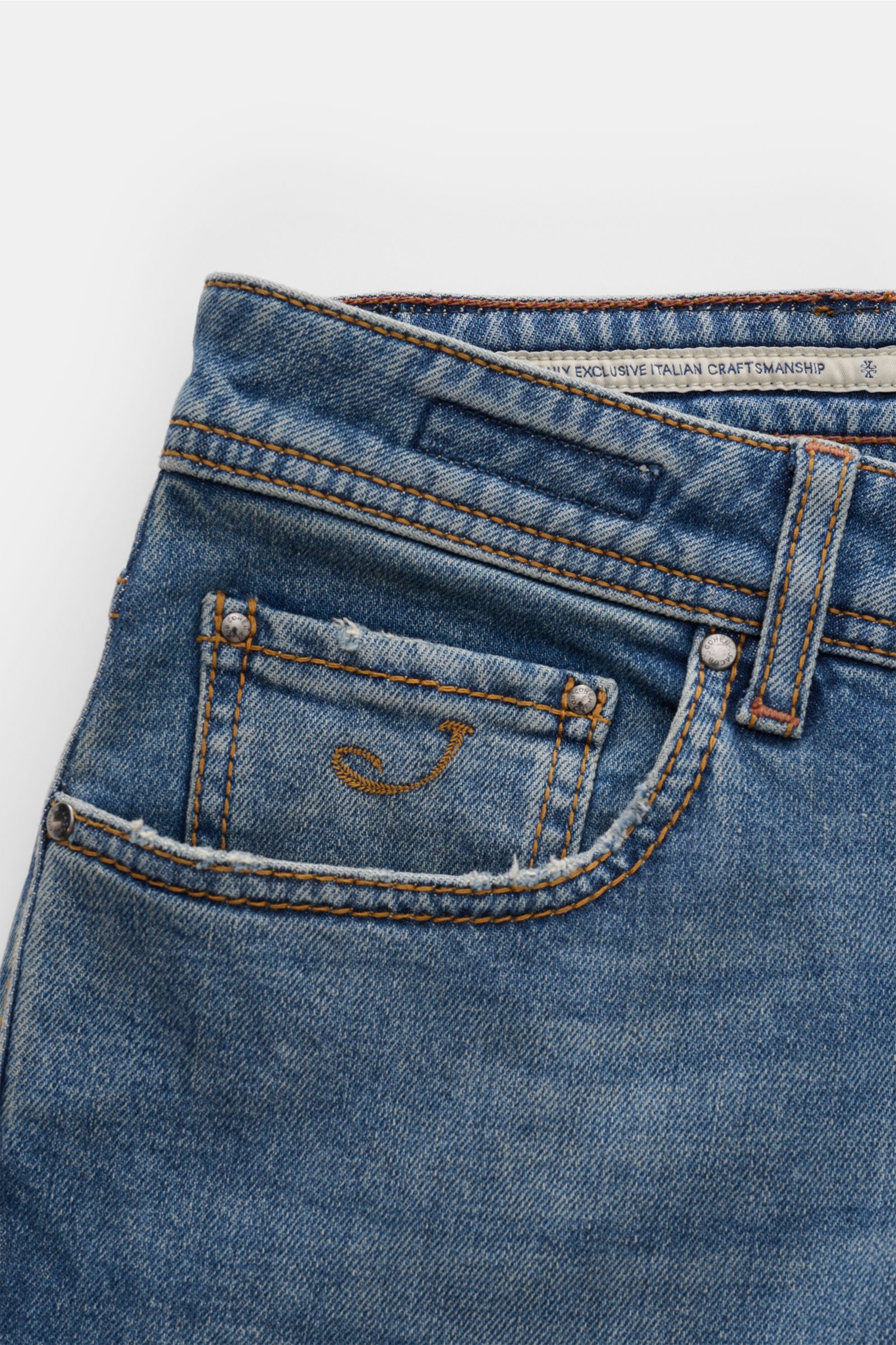 Close-up front view of Jacob Cohen Jeans 'Bard' smoky blue, featuring cotton and lyocell denim, slight stretch, subtle used wash, slim fit, tapered cut, button fly, five-pocket style with coin pocket initial, back pockets with stitching, and patch with st