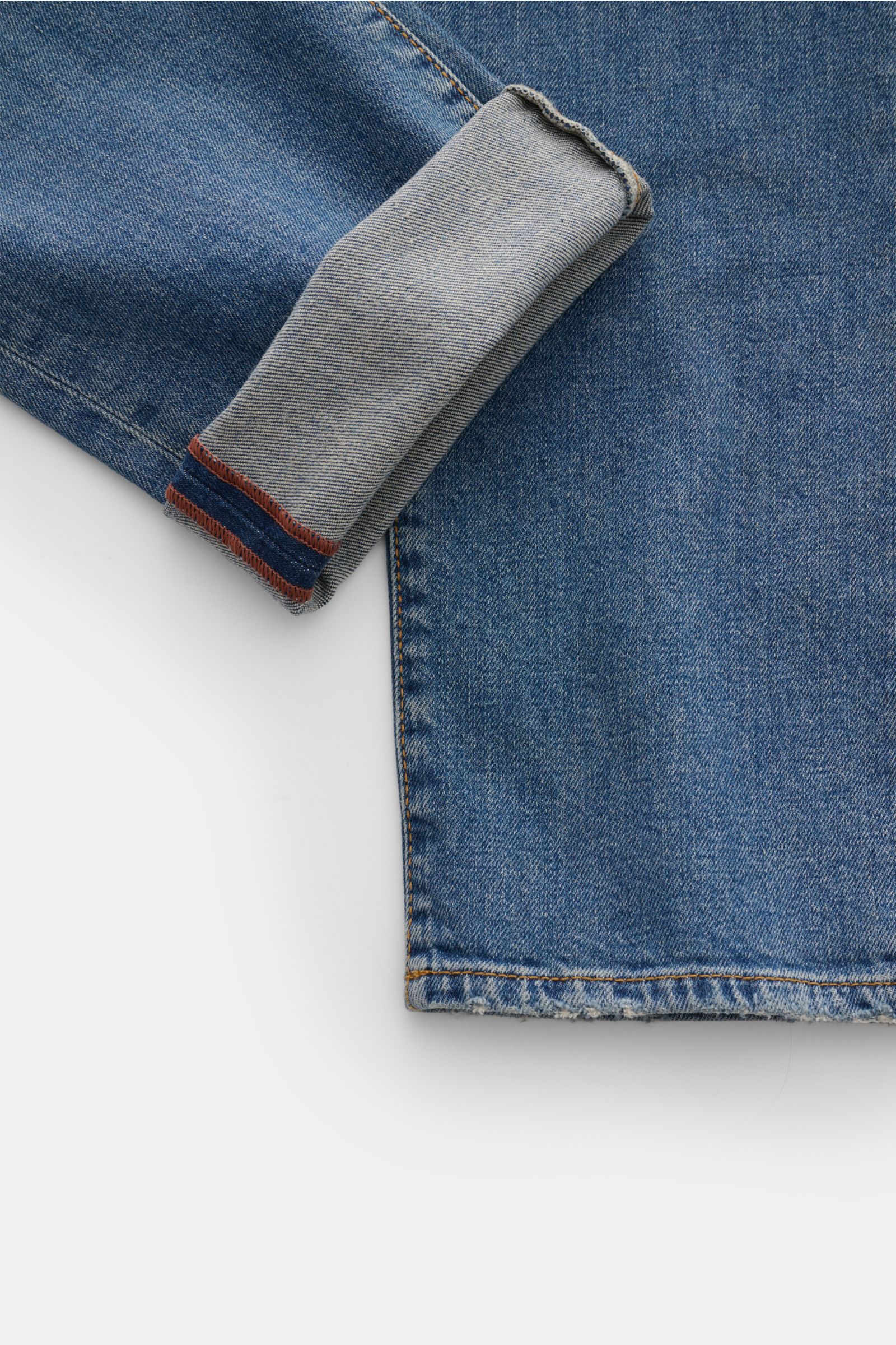 Close-up top-down view of the cuff and hem of Jacob Cohen Jeans 'Bard' smoky blue, showing slightly stretchy cotton and lyocell denim with subtle used wash and detailed stitching.