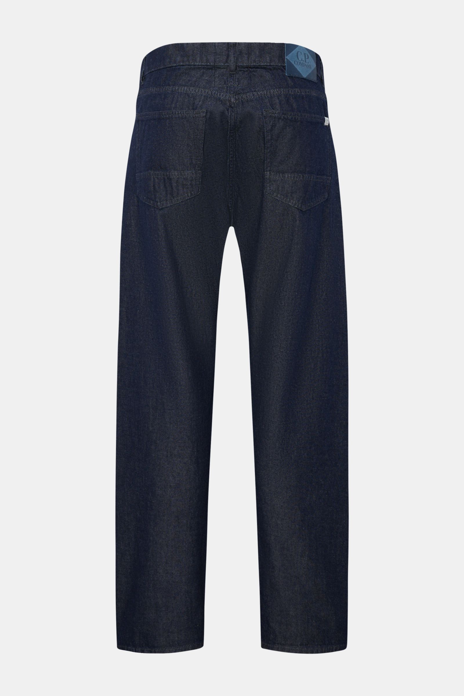 Rear view of C.P. Company Jeans navy in tapered fit with straight cut, five-pocket style, button fly, and leather patch, made of pure cotton.

Timeless companion: These jeans in a tapered fit by C.P. COMPANY have a casual silhouette and a premium finis