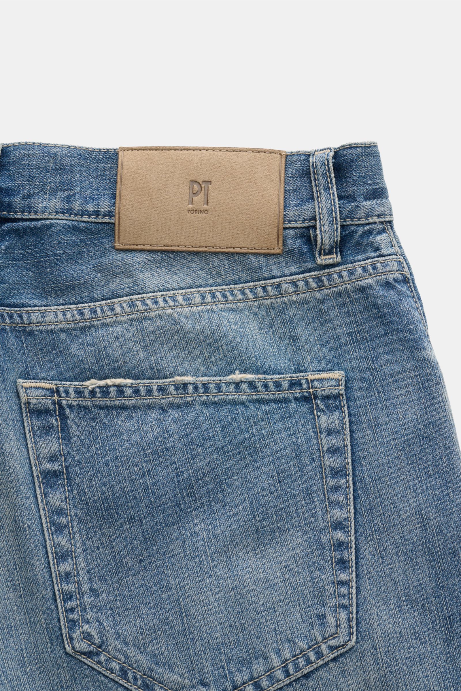 Close-up rear view of PT Torino Denim Jeans 'Breakbeat' smoky blue showing authentic used wash, leather patch, and back pocket details.