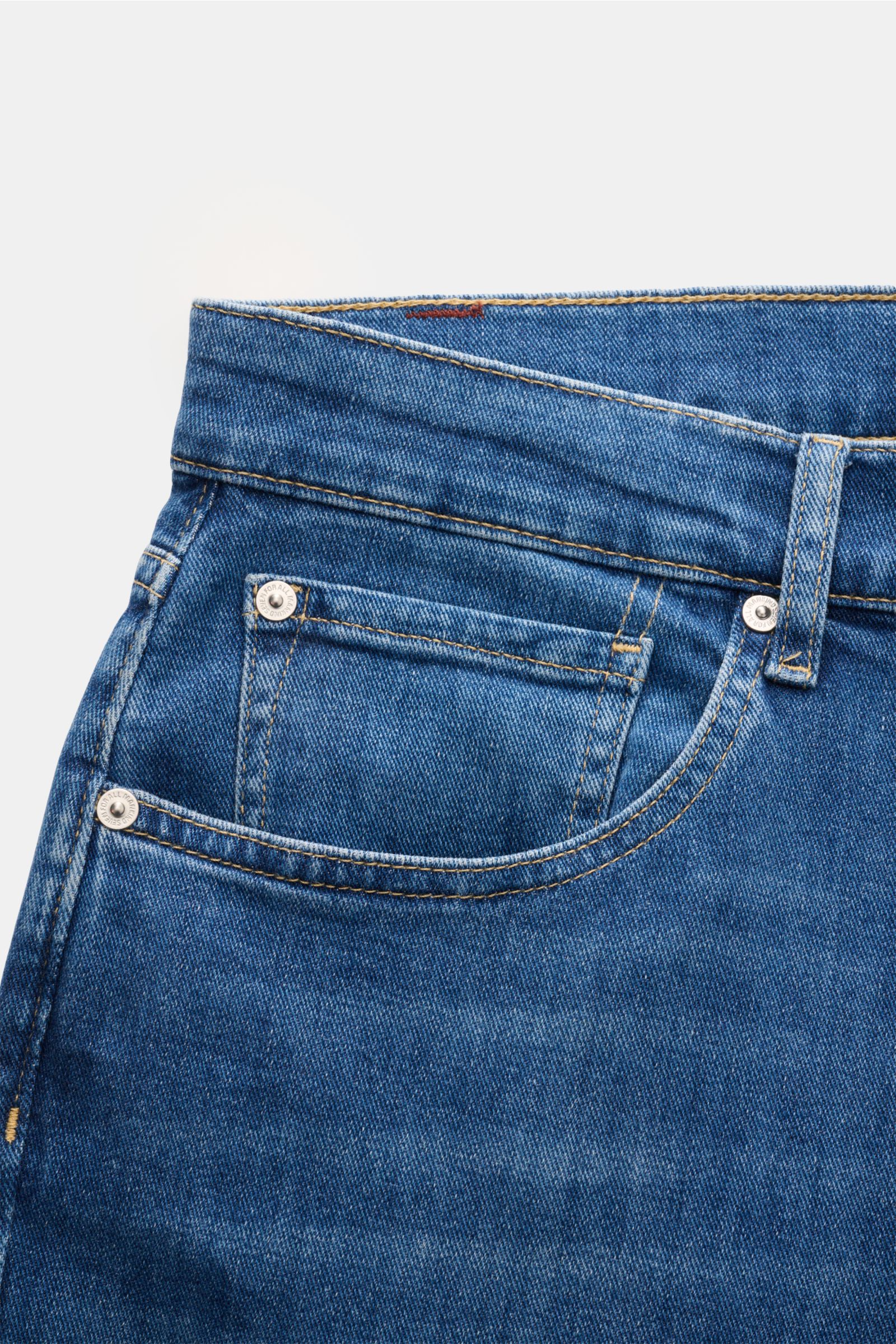 Close-up front view of 7 for all mankind Jeans 'The Straight' blue showing elasticated cotton fabric, soft feel, subtle used wash, regular fit, high waist, five-pocket style with zip fly, and tonal stitching with small woven label.