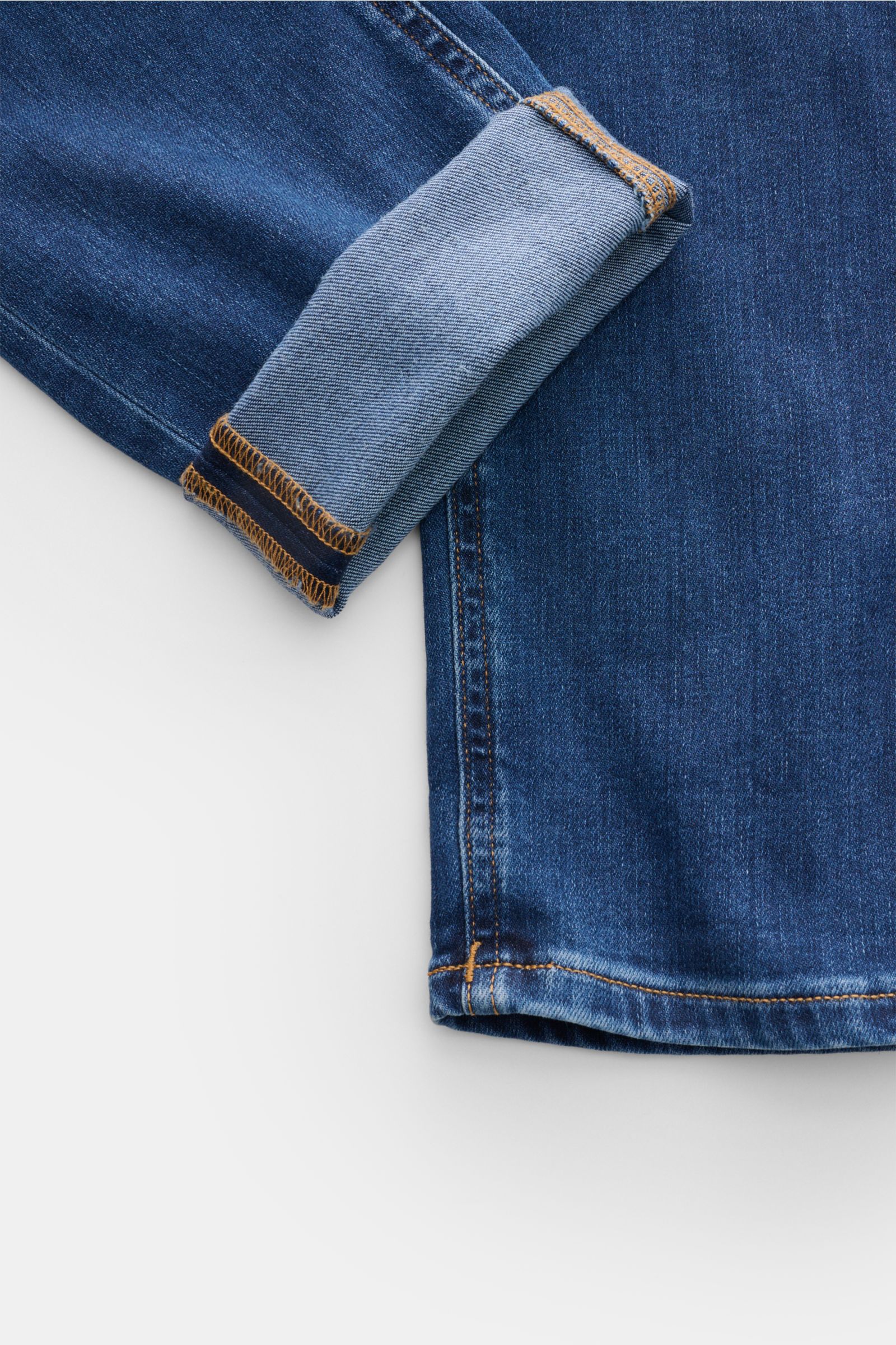 Dondup Jeans 'George' dunkelblau, Detailaufnahme vom Bein mit aufgekrempeltem Saum, elastischer Denim, Used-Waschung, Skinny Fit