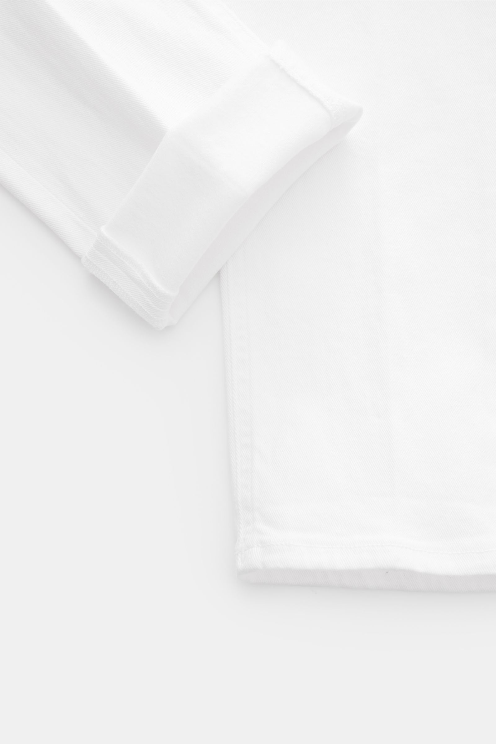 Dondup Jeans 'George' offwhite aus elastischer Baumwolle, Skinny Fit, niedrige Bundhöhe, Five-Pocket-Stil, Detailansicht Saum und Bein.