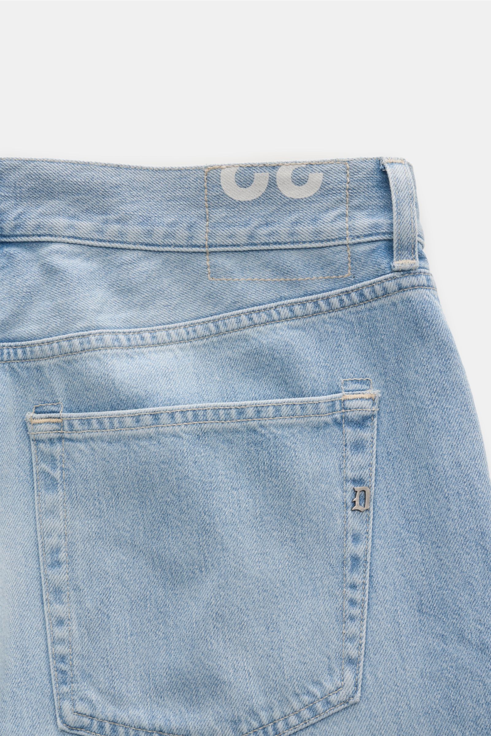 Close-up rear view of Dondup Jeans 'Bray' hellblau in light blue denim with authentic used wash, subtle distressed details, and metal initial on the pocket.