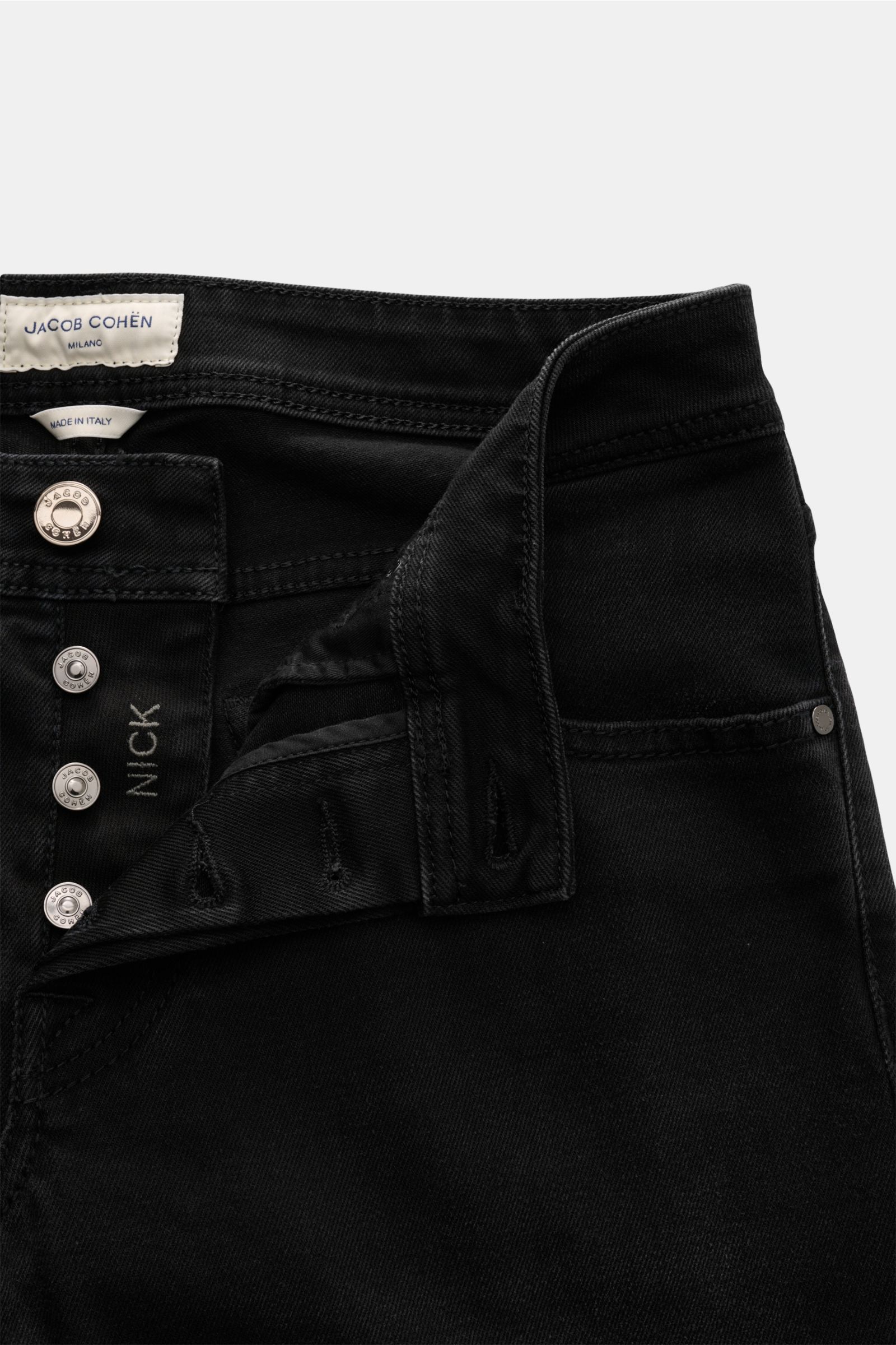 Jacob Cohen Jeans 'Nick' dunkelgrau shown from front close-up with button fly open, made of cotton and microfiber denim, elastic quality, soft touch, subtle used wash, slim fit, tapered, five-pocket style, coin pocket with initial, back pockets with stitc