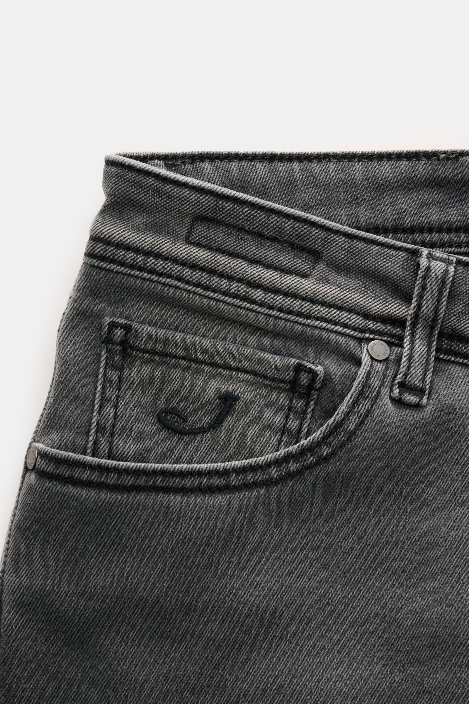 Close-up front view of Jacob Cohen Jeans 'Nick' grey showing denim made of cotton and microfibre, elasticated fabric, soft feel, subtle used wash, slim fit, tapered cut, button fly, five-pocket style, coin pocket with initial, back pockets with stitching,