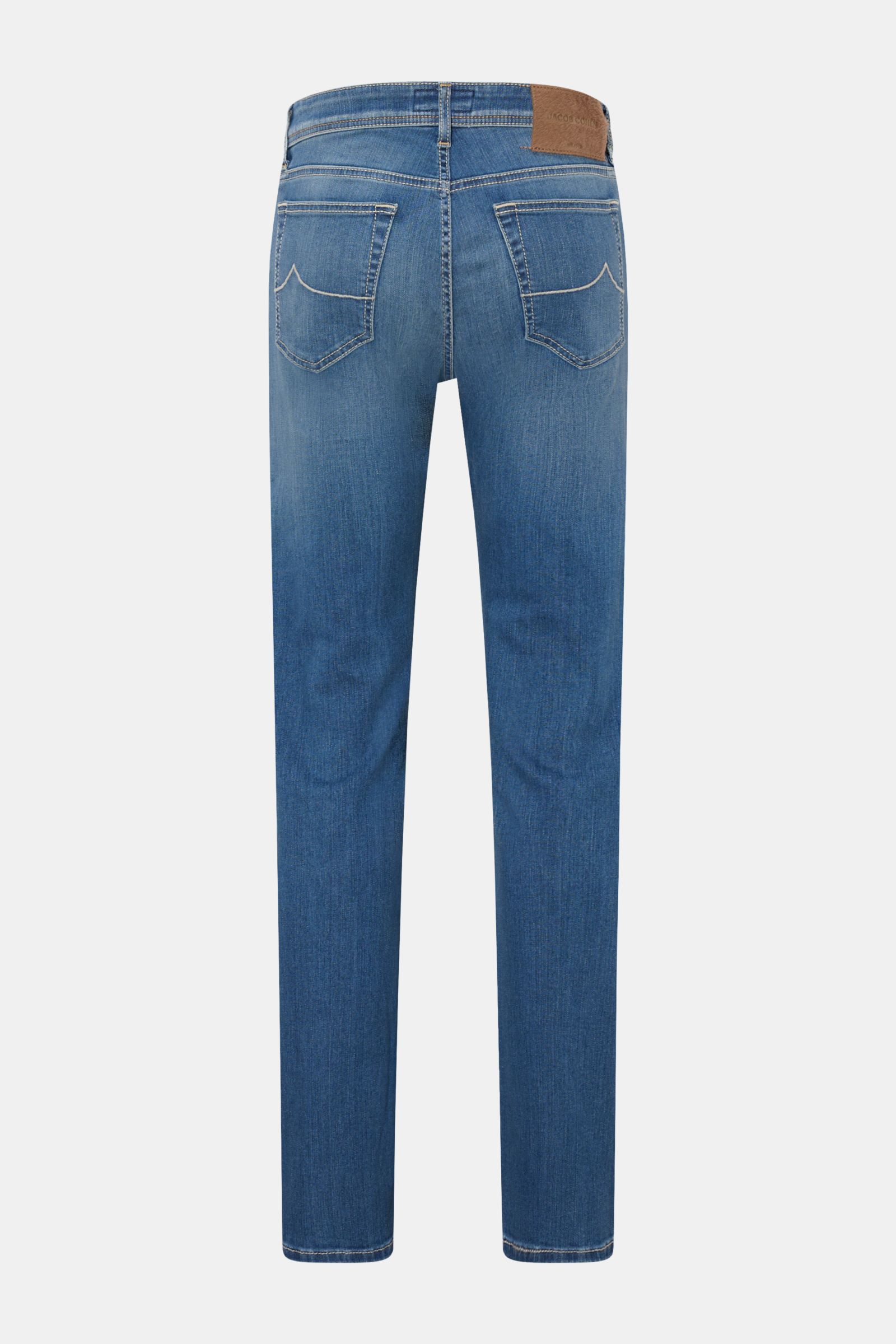 Rear view of Jacob Cohen Jeans 'Bard' rauchblau in soft, elastic cotton denim with subtle used wash, slim fit, tapered legs, button fly, five-pocket style, coin pocket with initial, back pockets with stitching, and a pony hair leather patch.
