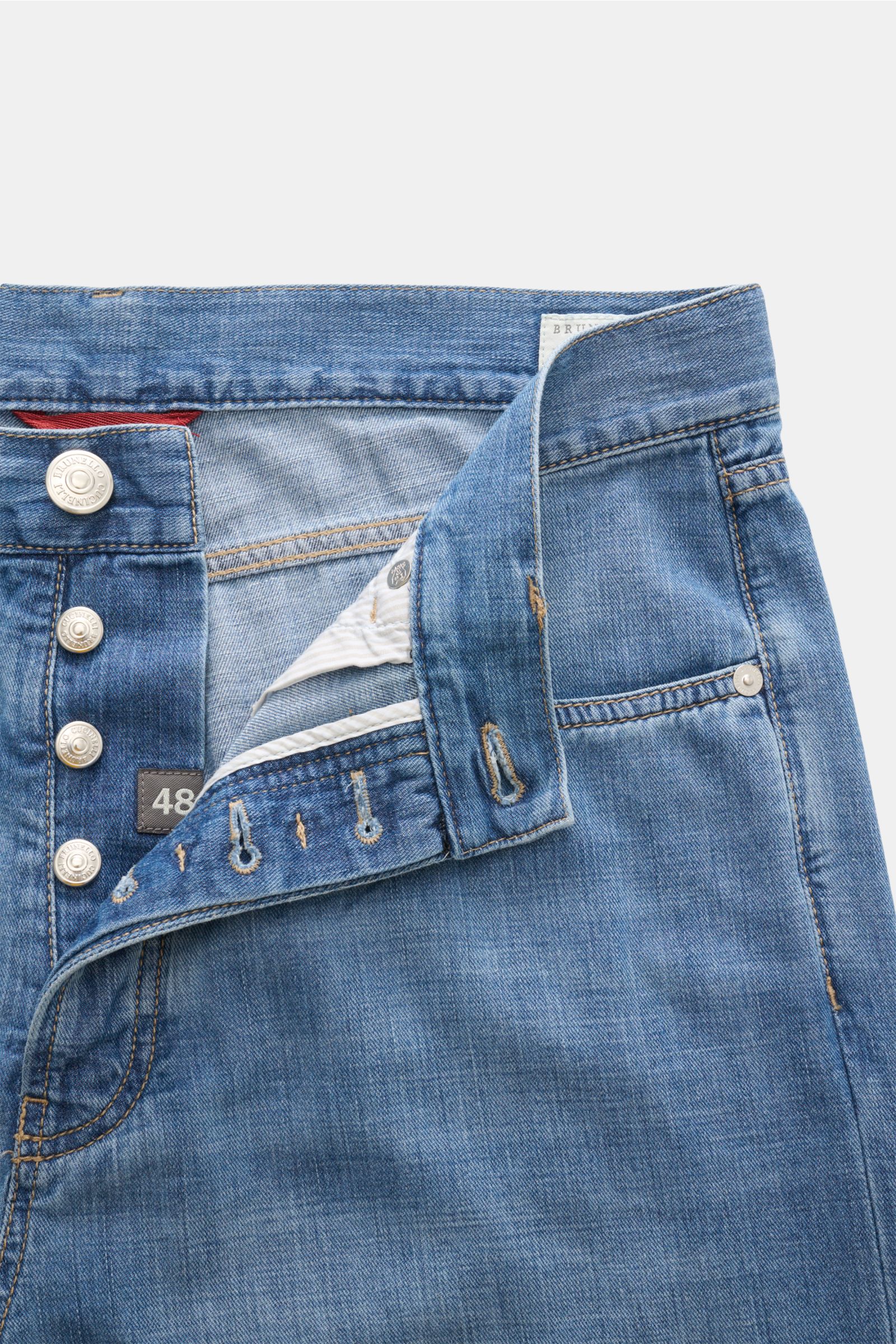 Brunello Cucinelli Jeans 'Iconic Fit' smoky blue shown from the front top with button fly open, slim fit, high waist, and soft pure cotton denim.