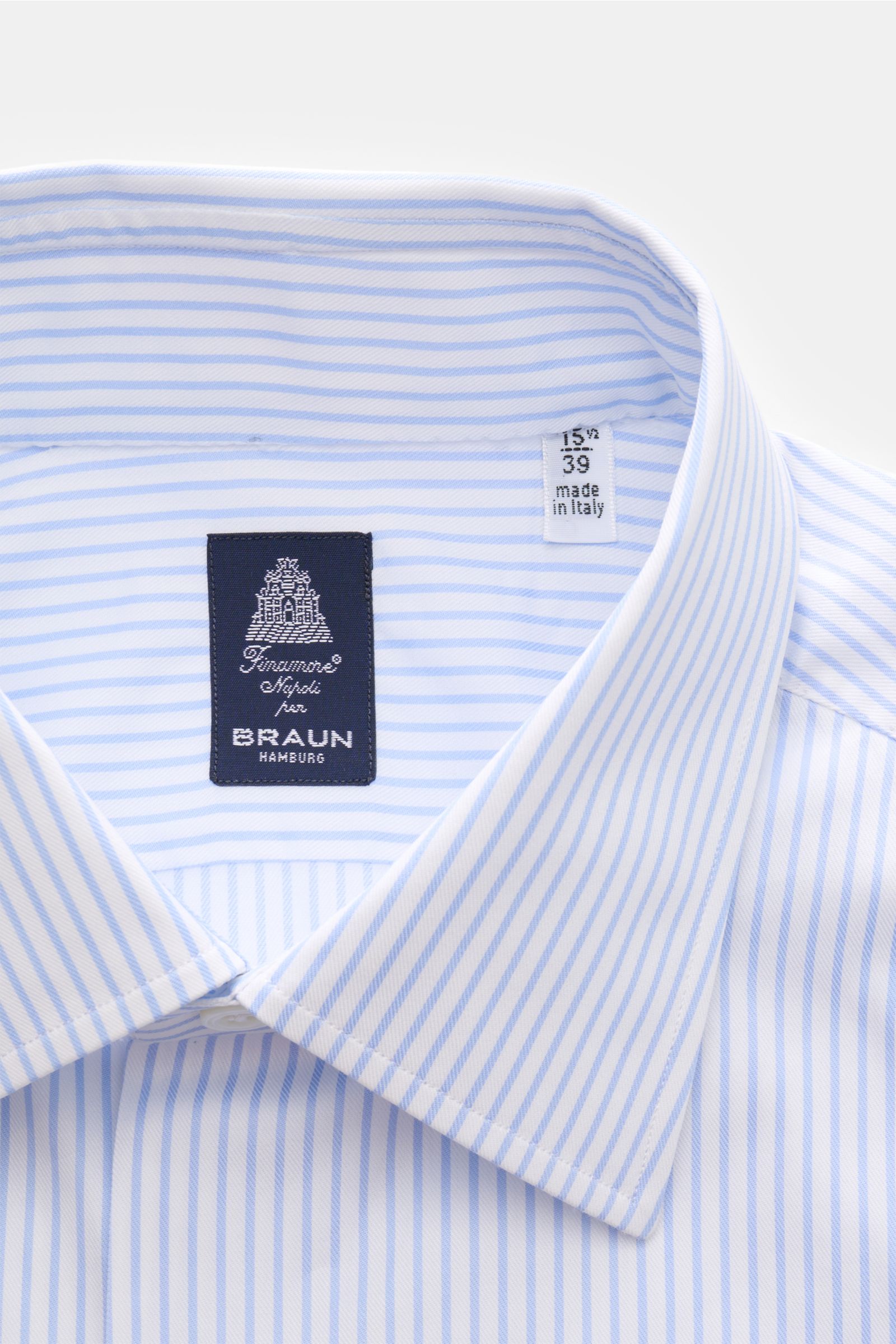 Finamore Business shirt 'Rodi Napoli' Kent collar light blue/white striped, close-up front view, fine cotton gabardine, smooth feel, slim fit, extra-long sleeves, Kent collar, French button placket, classic barrel cuffs, rounded hem.