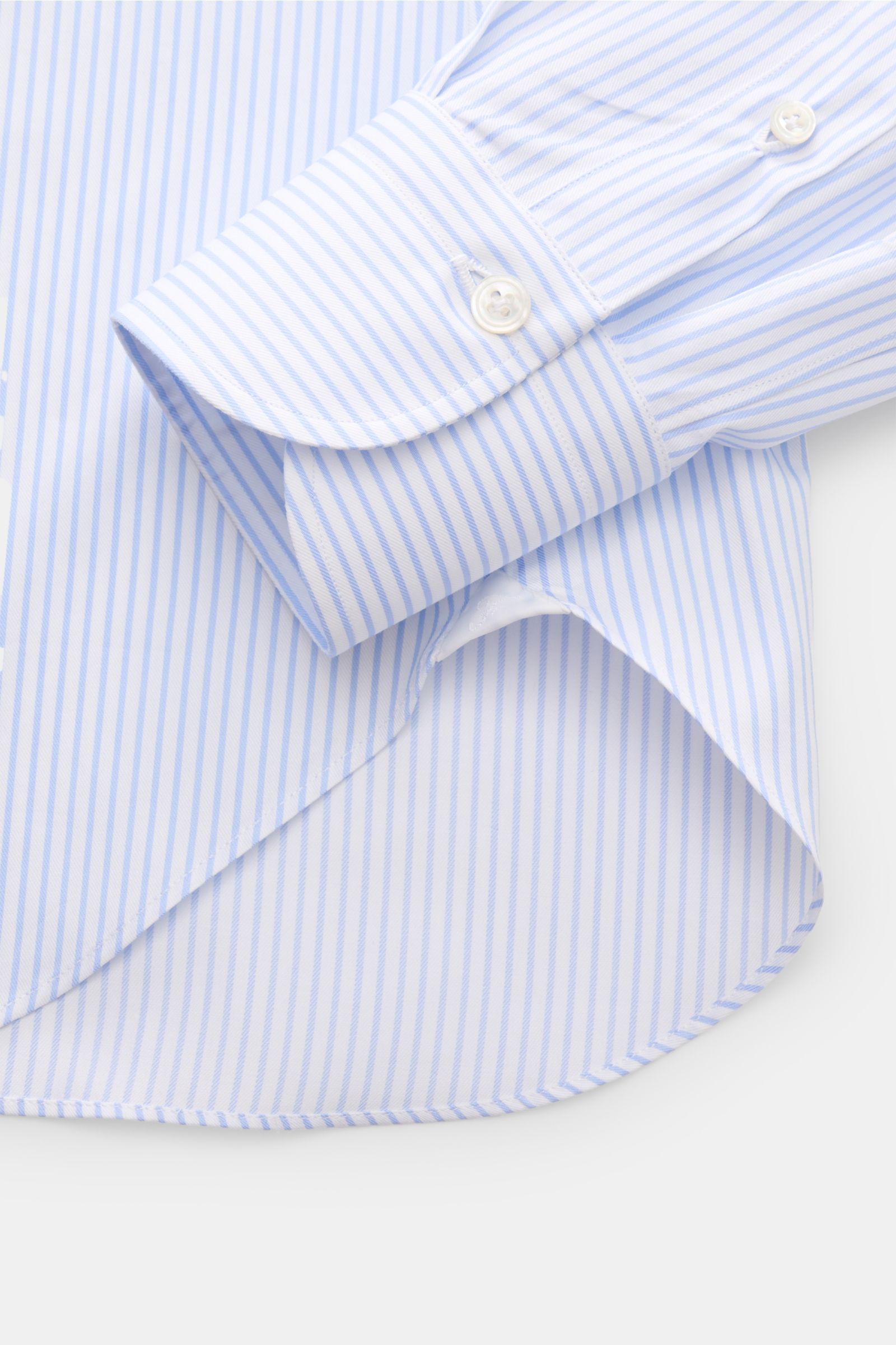 Finamore Business shirt 'Rodi Napoli' Kent collar light blue/white striped shown from a close-up side angle, featuring fine cotton gabardine, smooth feel, slim fit, extra-long sleeves, Kent collar, French button placket, classic barrel cuffs, and rounded 