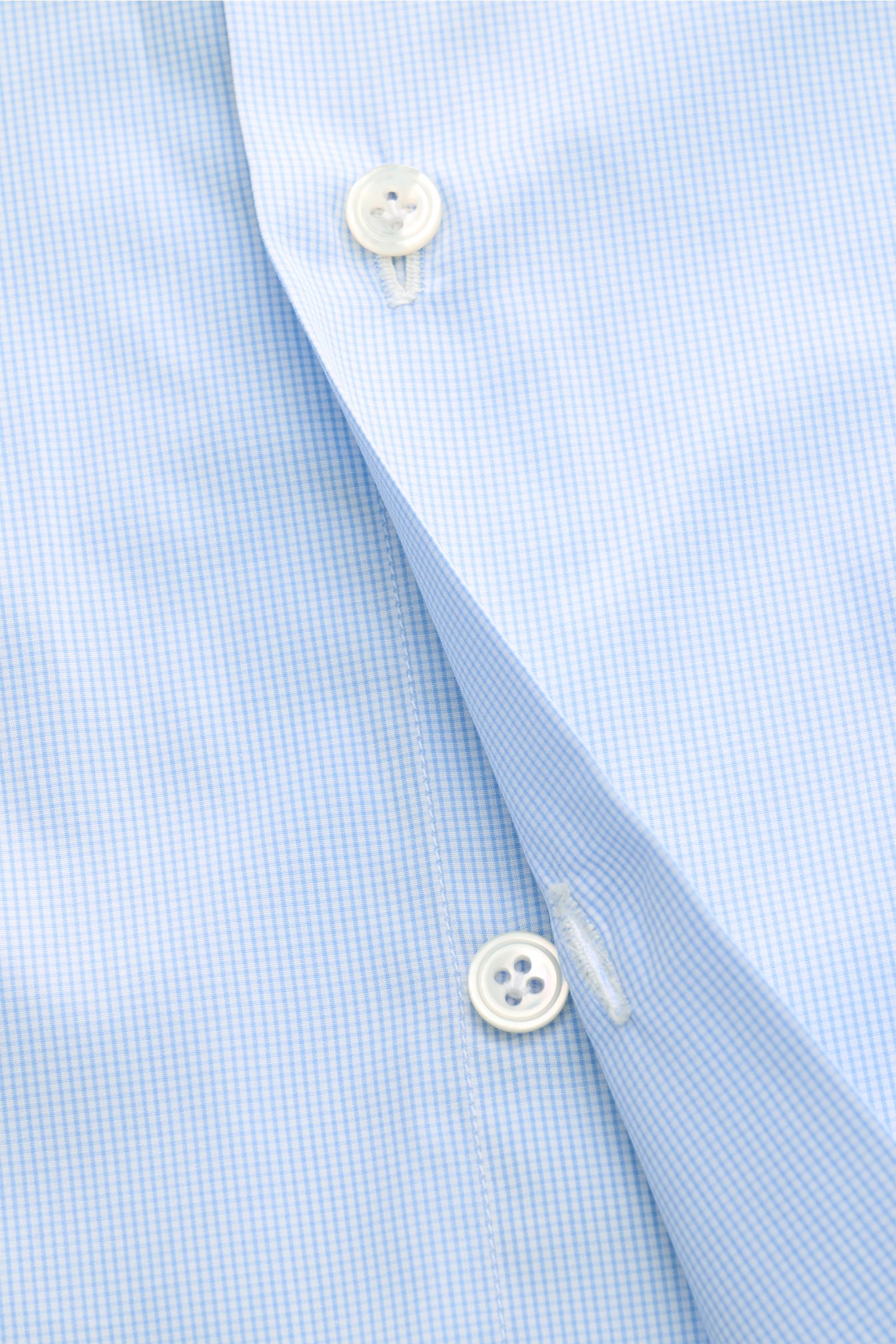 Close-up front view of Finamore Business shirt 'Sergio Milano' shark collar, light blue/white checked, showcasing pure Giza cotton, cool smooth touch, micro graph check, extra slim fit, French button placket with mother-of-pearl buttons, classic barrel cu