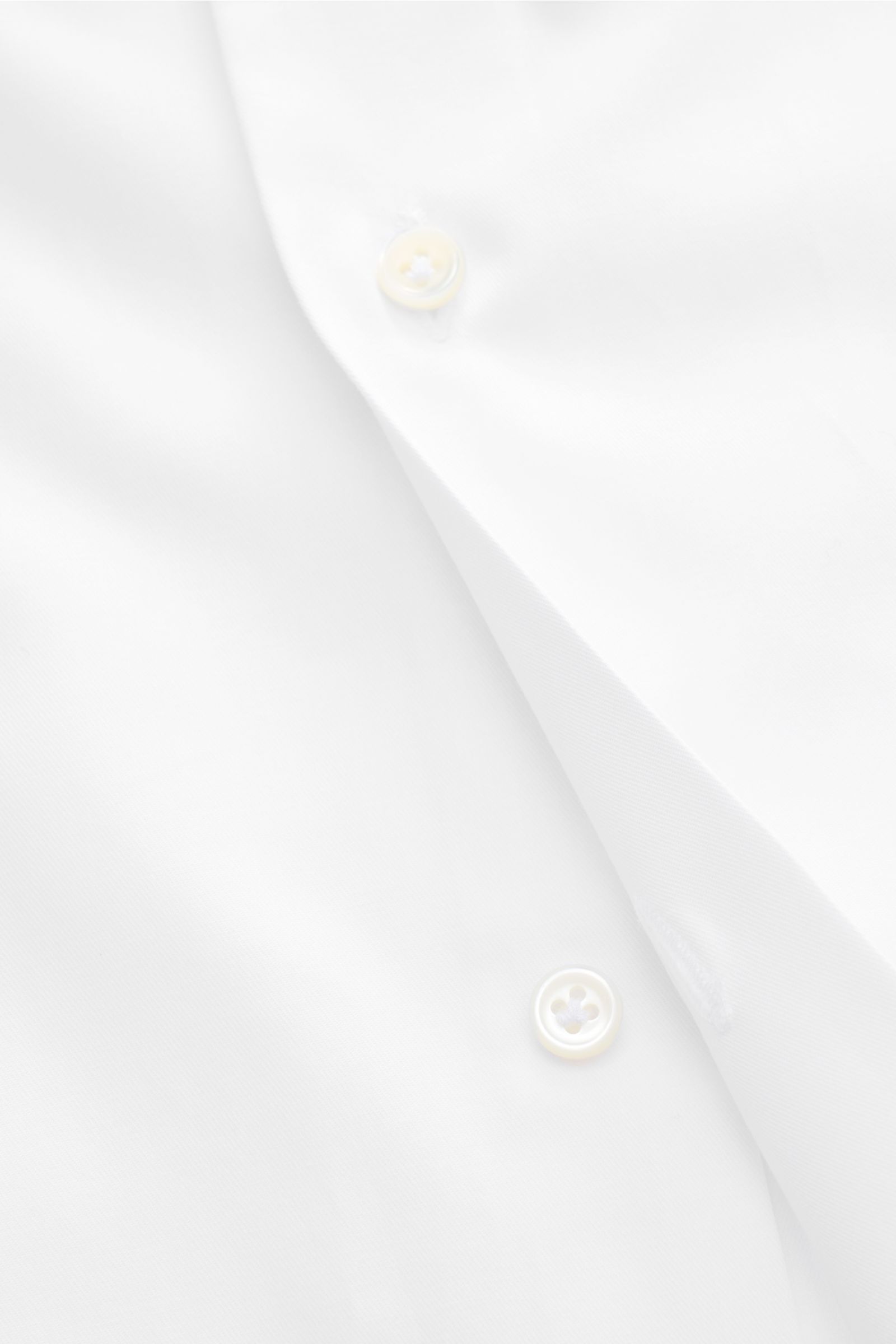 Close-up front angle view of the Gherardi Business shirt shark collar white, made of pure cotton gabardine with a smooth touch, lightweight fabric, slim fit, shark collar, French button placket, classic barrel cuffs, split back yoke, waist darts at the ba
