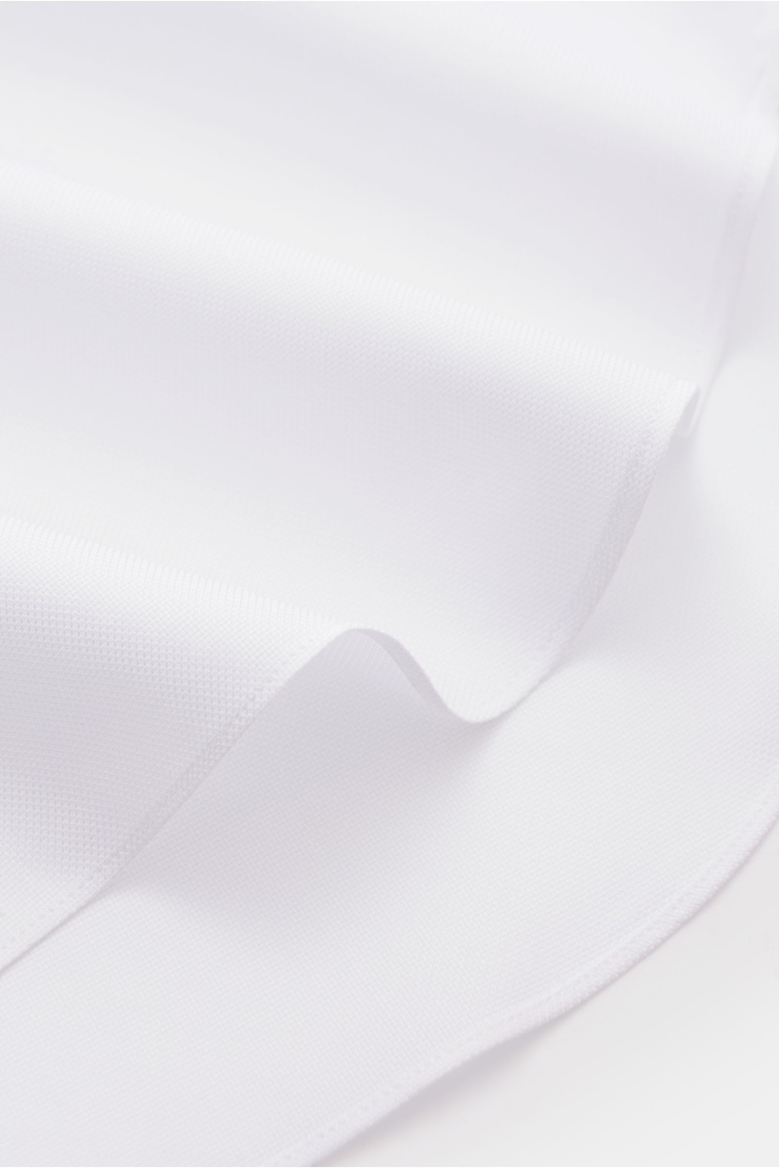 Close-up front angle of Finamore Business shirt 'Sergio Napoli' shark collar white showing pure cotton Oxford fabric texture and smooth finish.

A stylish office look: The 'Sergio Napoli' shirt by FINAMORE offers classic design and will become a busine
