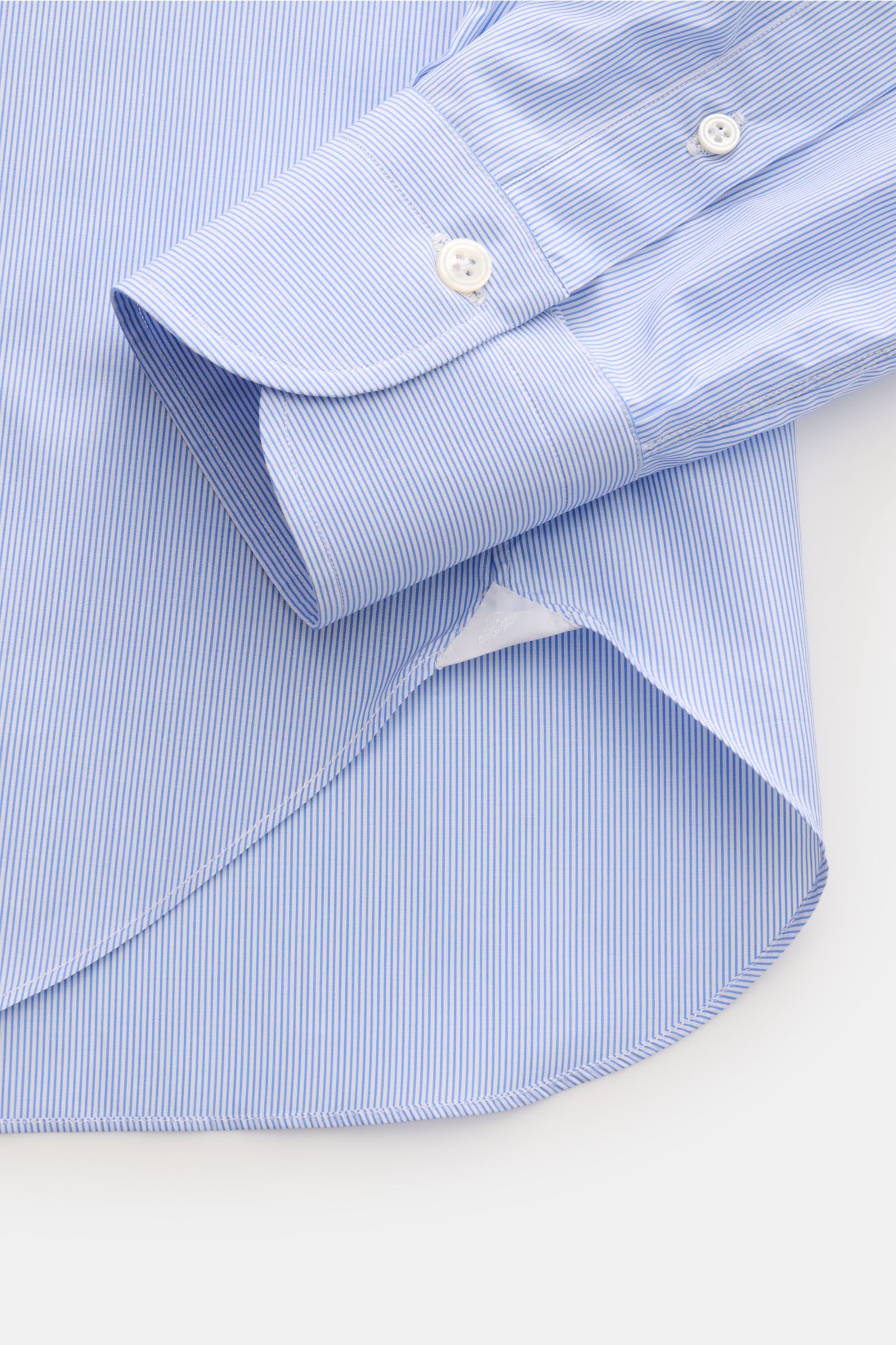 Alt tag (125 characters max): Close-up side view of Finamore Business shirt 'Edoardo Napoli' shark collar blue/white striped cuff and rounded hem.

Description: 
The model 'Edoardo Napoli' from traditional Italian company FINAMORE features a smooth, co
