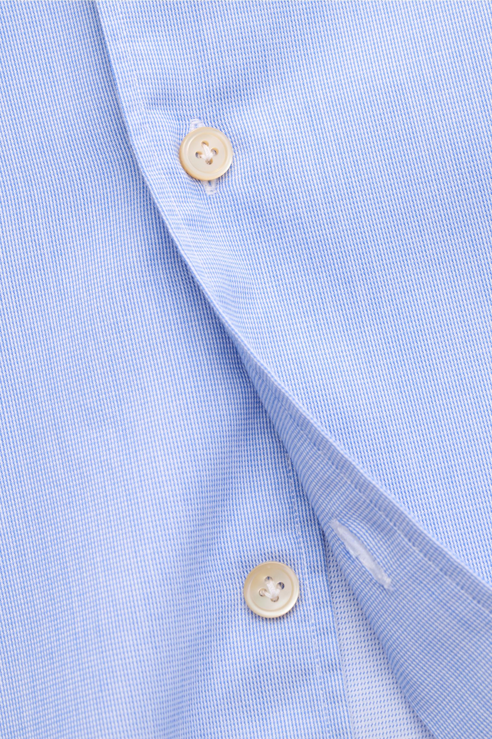 Close-up front view of Borrelli Casual shirt 'Ettore' shark collar blue, showing pure cotton twill fabric, slightly robust texture, slim fit, French button placket with mother-of-pearl buttons, classic barrel cuffs, and rounded hem.