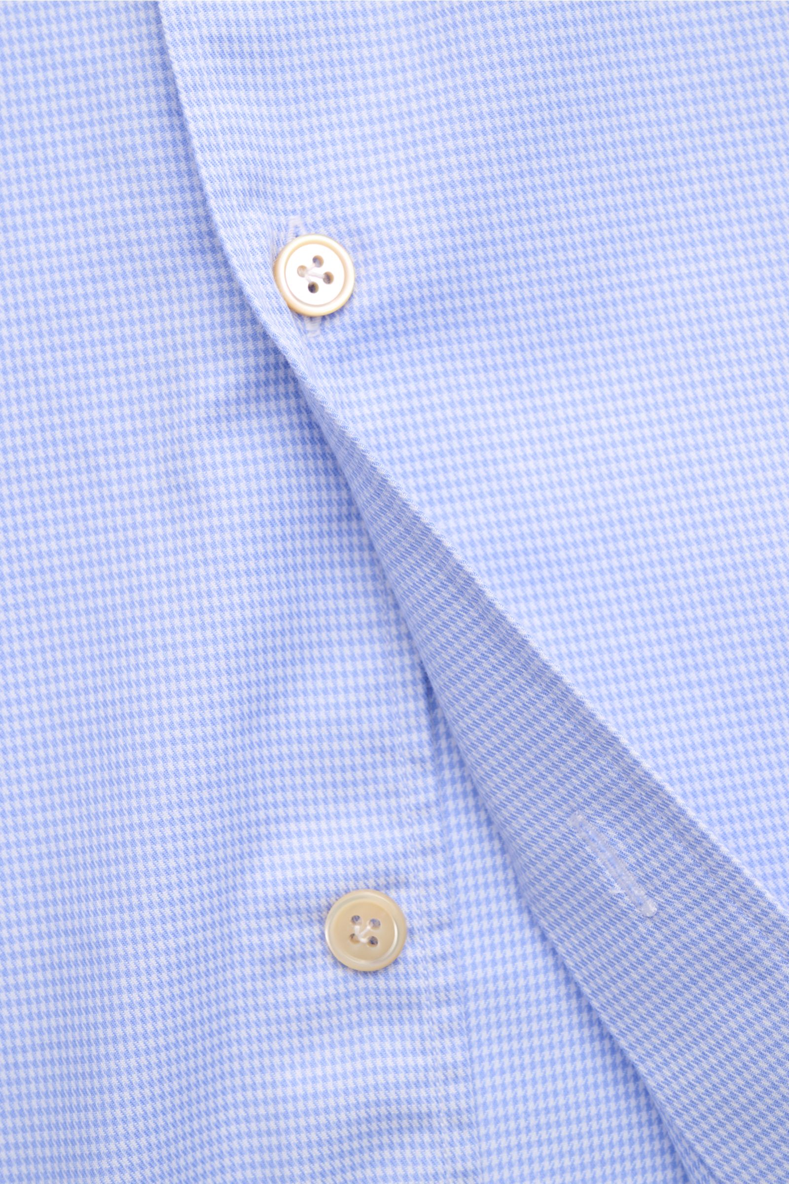 Close-up front view of Borrelli Casual shirt 'Ettore' shark collar blue/white checked, showing micro houndstooth pattern, pure cotton twill, smooth feel, slim fit, French button placket with mother-of-pearl buttons, classic barrel cuffs, and rounded hem.
