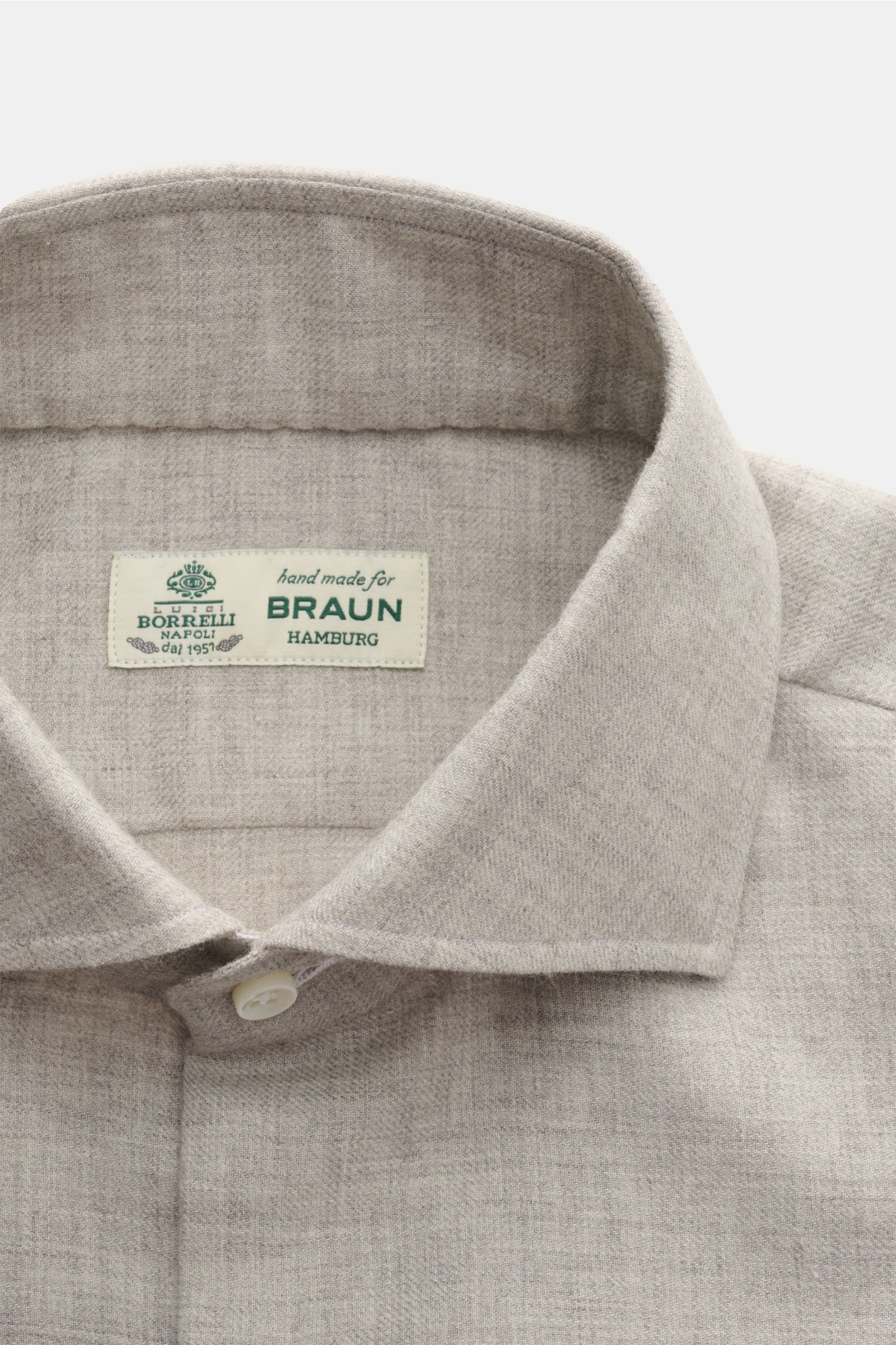 Close-up front view of Borrelli Flannel shirt 'Ettore' shark collar grey mottled, twill in cotton and wool, brushed, smooth feel, slim fit, French button placket with mother-of-pearl buttons, classic barrel cuffs, rounded hem.