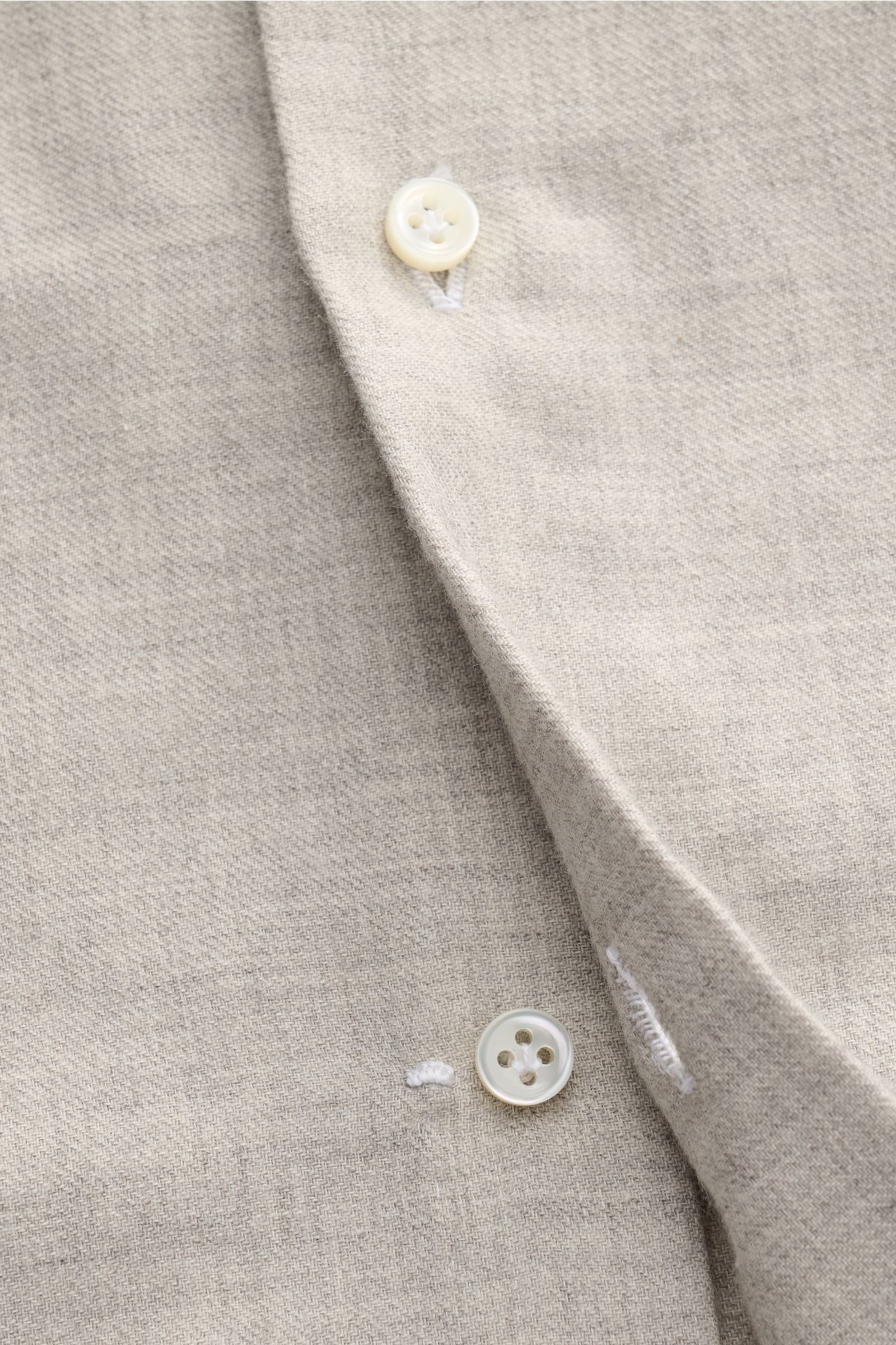 Close-up front view of Borrelli Flannel shirt 'Ettore' shark collar grey mottled, showing twill cotton and wool fabric, brushed smooth feel, mother-of-pearl buttons on French placket, classic barrel cuffs, slim fit, and rounded hem.
