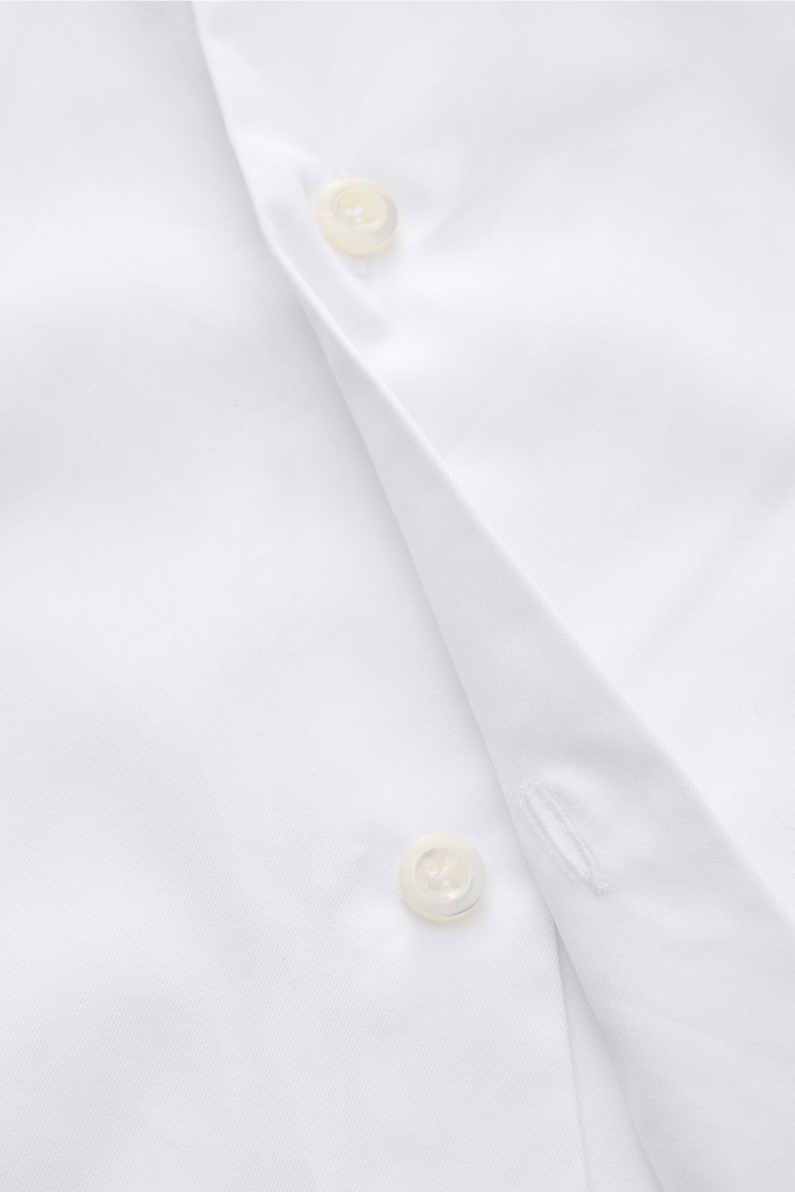 Close-up front view of Giampaolo Casual shirt shark collar white showing white buttons and pure cotton fabric texture.

Timeless classic: This stylish shirt by GIAMPAOLO works as an office and casual shirt because of its comfortable, pure cotton materi