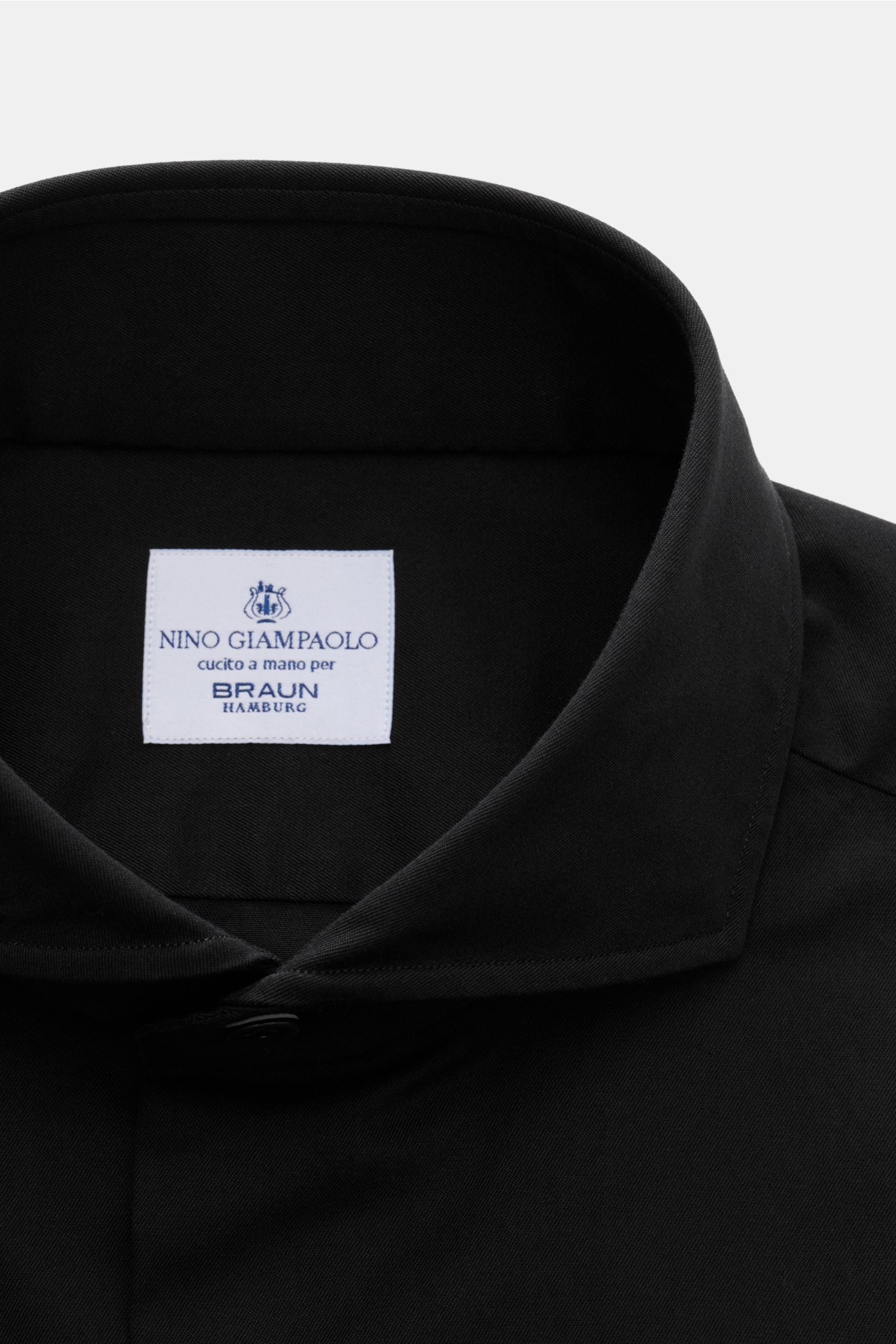 Close-up front view of Giampaolo Casual shirt shark collar black, showcasing the shark collar and label on pure cotton material.

Timeless classic: This stylish shirt by GIAMPAOLO works as an office and casual shirt because of its comfortable, pure cot