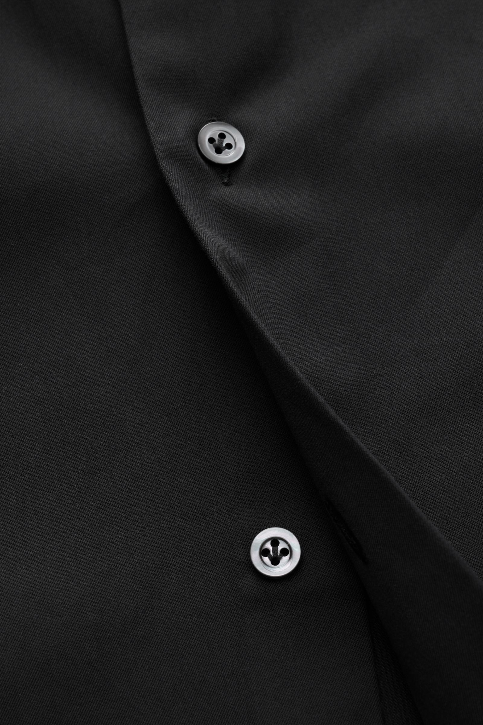 Close-up front view of Giampaolo Casual shirt shark collar black, showing black pure cotton popeline fabric with slightly textured feel and buttons.

Timeless classic: This stylish shirt by GIAMPAOLO works as an office and casual shirt because of its c