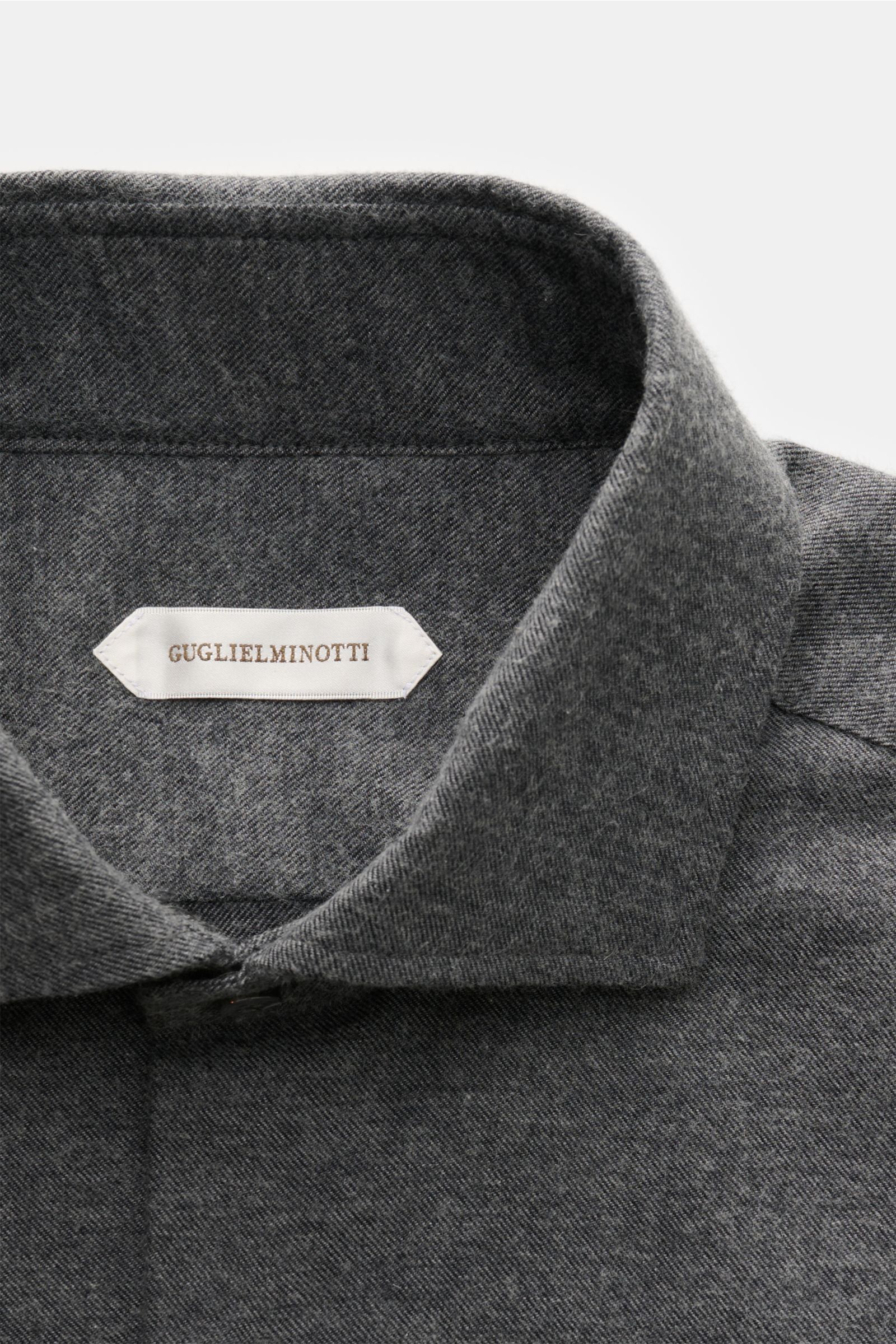 Close-up front view of the Guglielminotti Flannel shirt shark collar dark grey melange, made of cotton and cashmere flannel with soft feel, regular fit, shark collar, French button placket, classic barrel cuffs, waist darts at the back, and rounded hem.