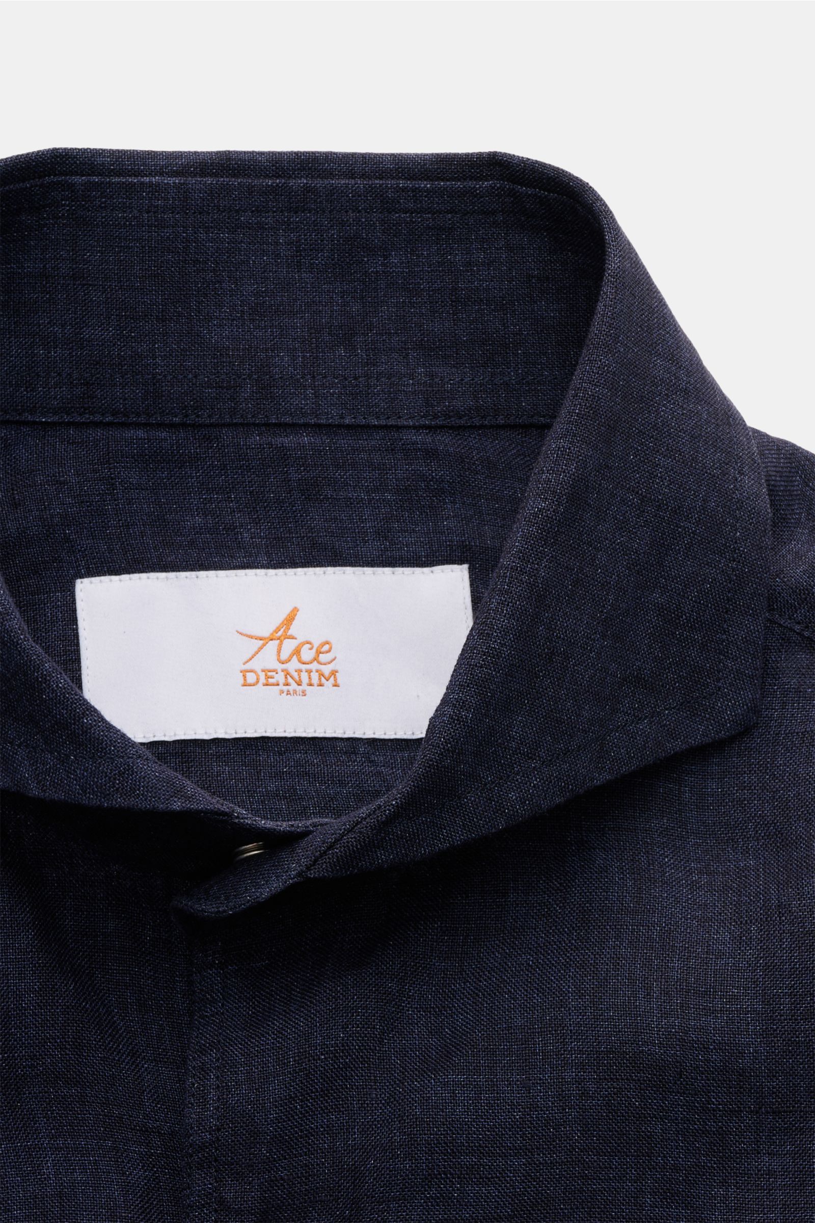 Close-up front view of the Ace Denim Linen shirt shark collar navy in lightweight navy pure linen fabric with visible yarn texture.

Stay comfortable in the warmer months: This ACE DENIM shirt in lightweight linen fabric is a casual statement piece for