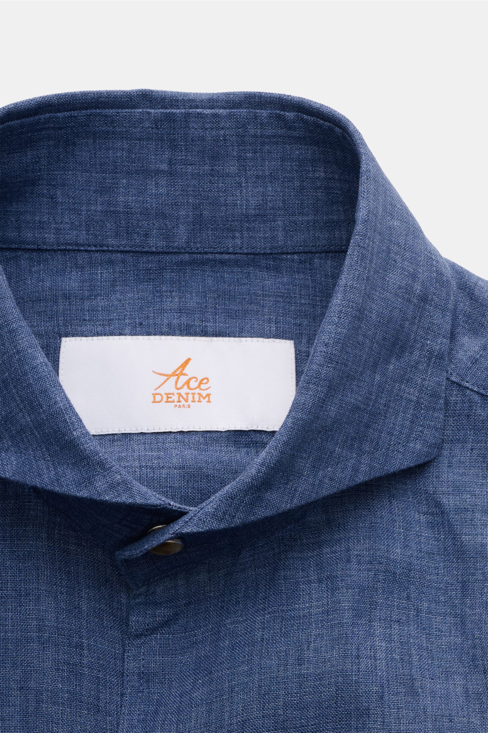 Close-up front view of Ace Denim Linen shirt shark collar grey-blue showing the shark collar, French button placket with snap buttons, and linen texture. Stay comfortable in the warmer months: This ACE DENIM shirt in lightweight linen fabric is a casua