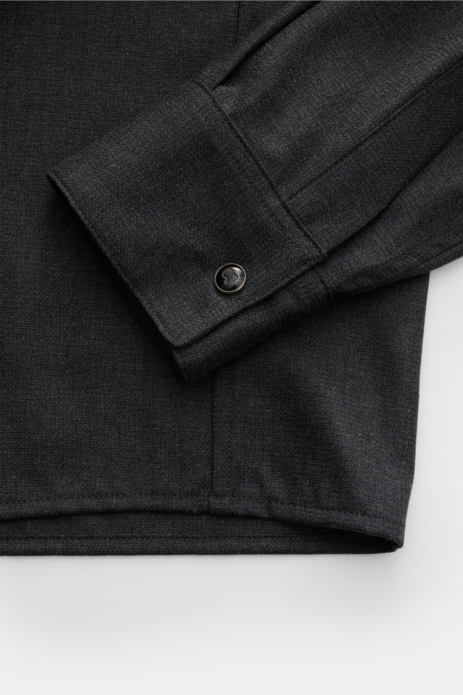 Close-up image from above of the sleeve and hem of the Marco Pescarolo Casual shirt 'Next' Kent collar anthracite mottled, showing the fine fabric texture and classic barrel cuff with a French button.

Exclusive casual look with maximum comfort: This e