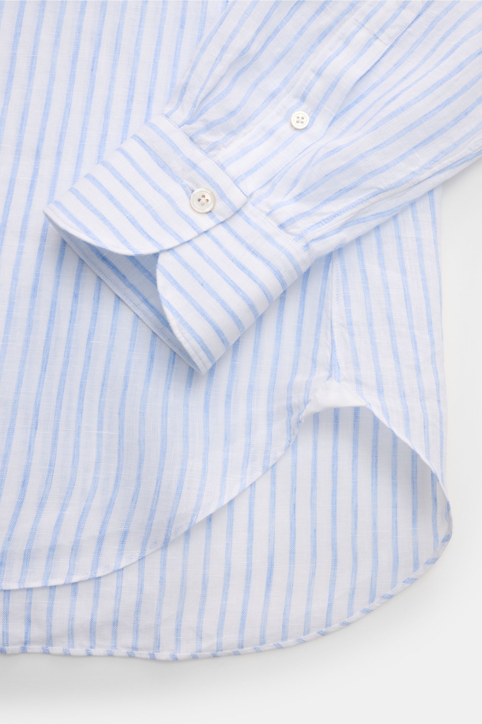 Close-up front view of the Finamore Linen shirt 'Sergio Gaeta' shark collar light blue/white striped showing lightweight fabric, French button placket, and rounded hem. Perfectly equipped for warm days: This linen shirt 'Sergio Gaeta' made of airy fabric 
