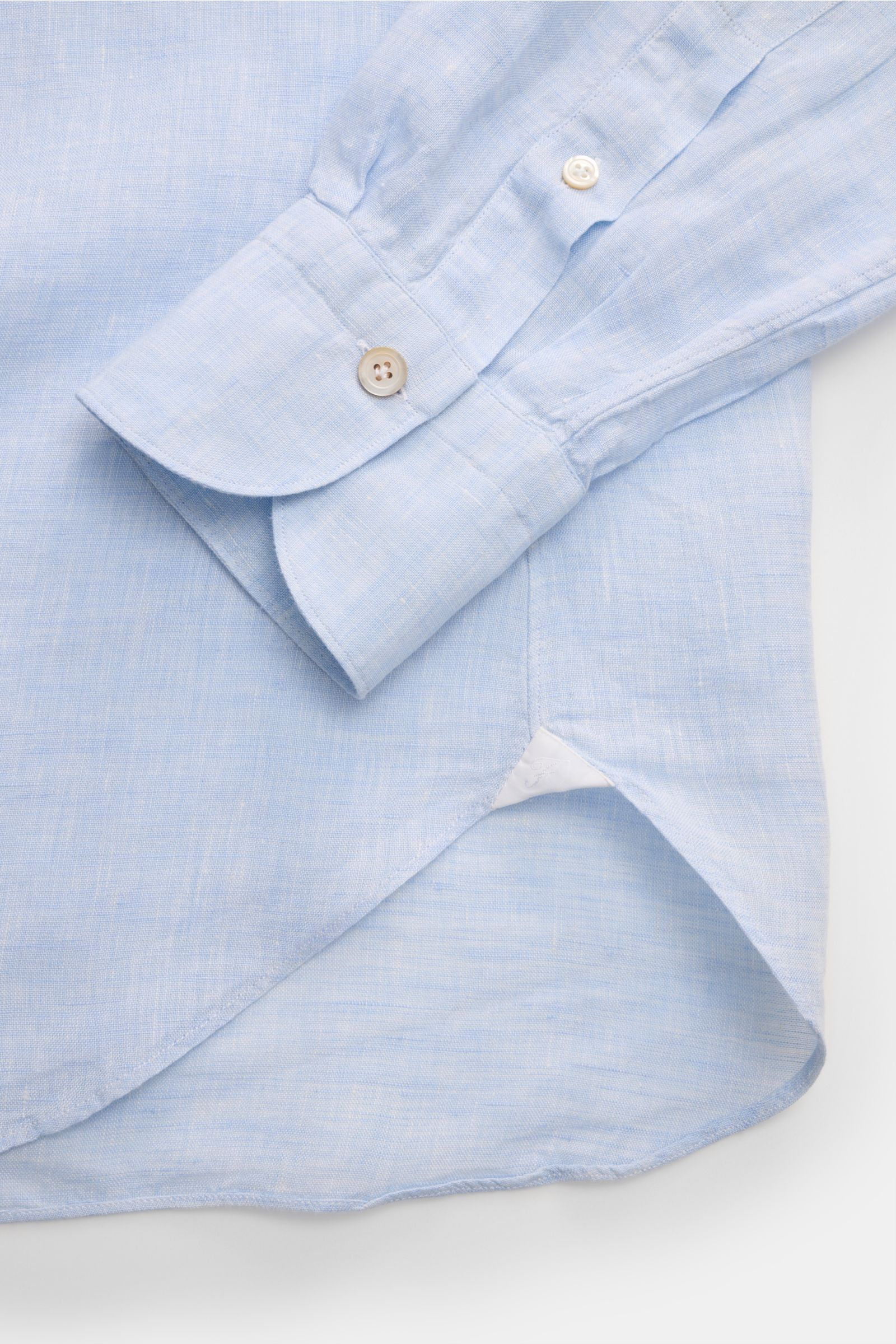Finamore Linen shirt 'Sergio Gaeta' shark collar light blue shown from top side close-up, featuring pure linen, soft feel, regular fit, shark collar, French button placket, classic barrel cuffs, extra-long sleeves, and rounded hem.